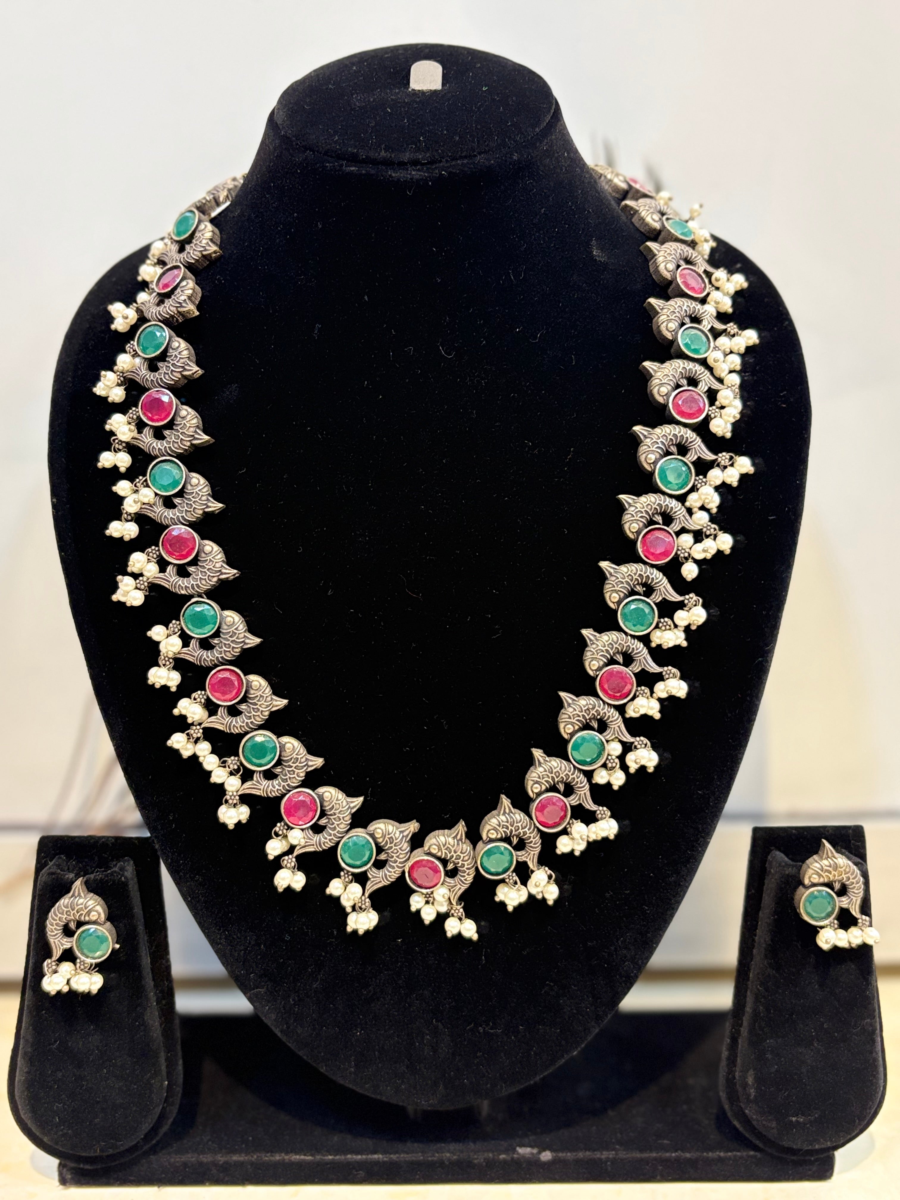 Name: fish Design Oxidized Necklace Set German silver with green and pink stone detailing and pearl drops