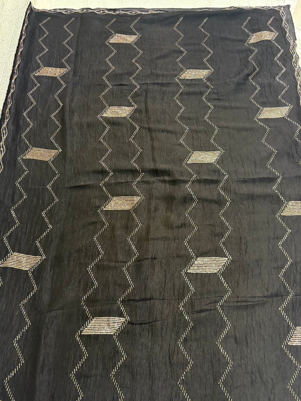 Name: Black Zigzag Embroidered Saree
Fabric: Lightweight crepe georgette with metallic thread embroidery