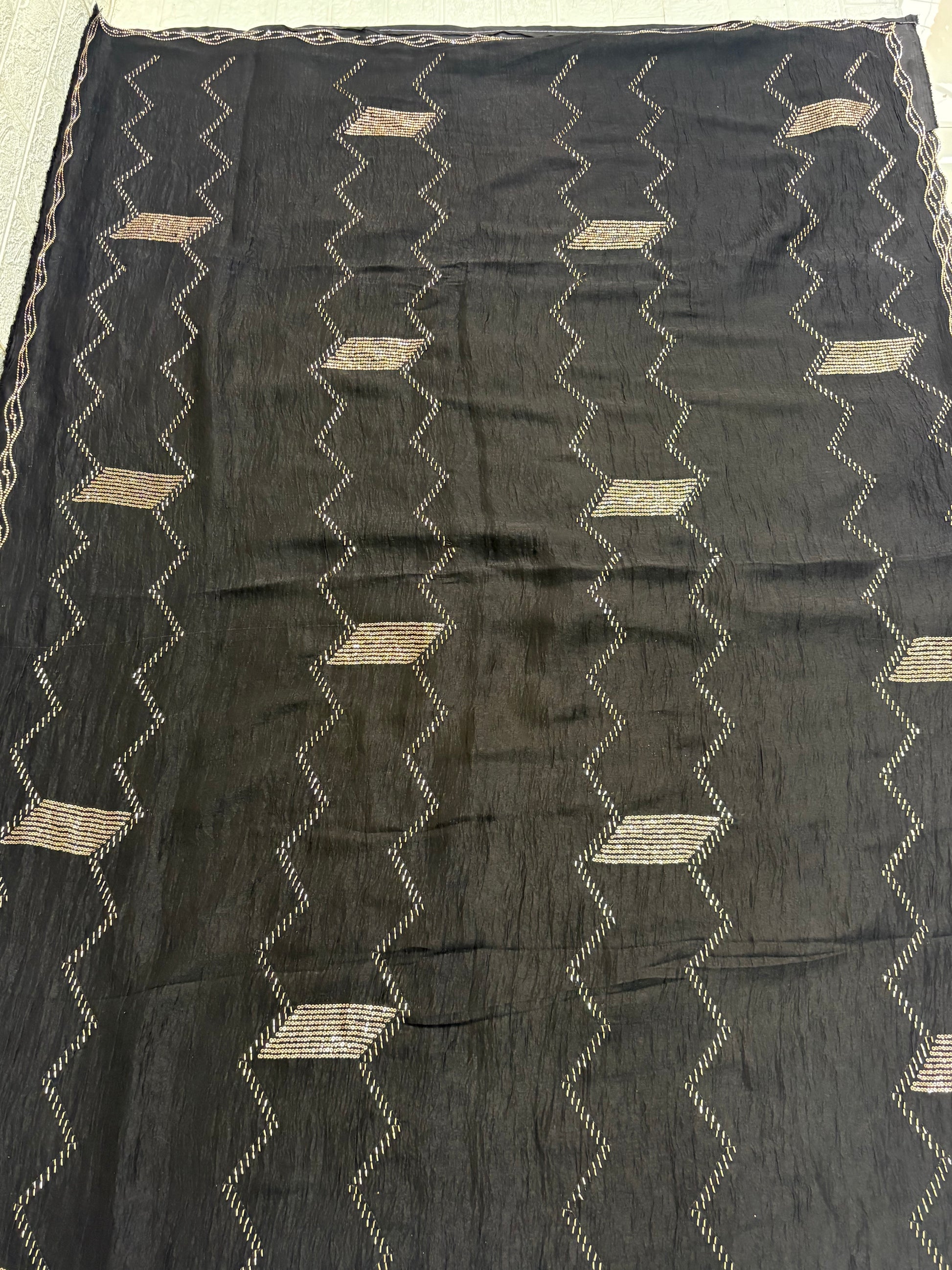 Name: Black Zigzag Embroidered Saree
Fabric: Lightweight crepe georgette with metallic thread embroidery