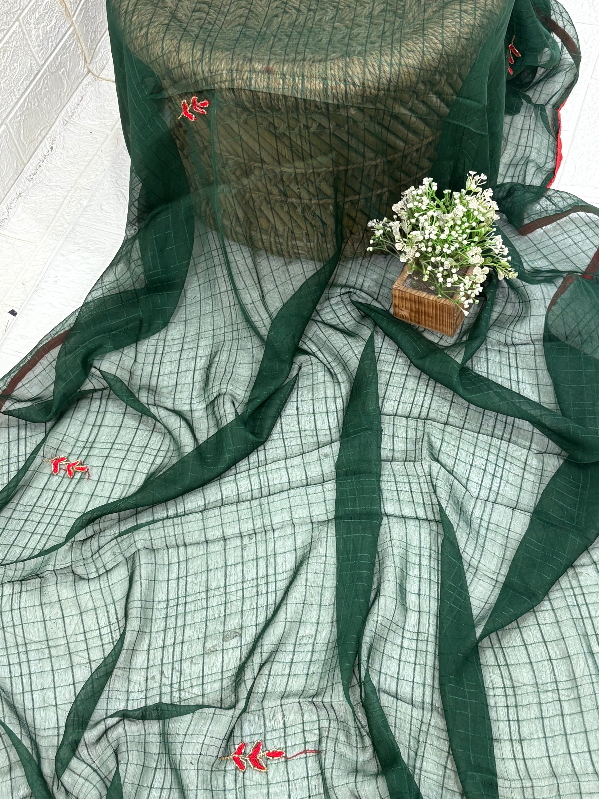 Lightweight green shimmer soft georgette self texture with embroider featuring delicate thread embroidery and red plain blouse perfect for festival