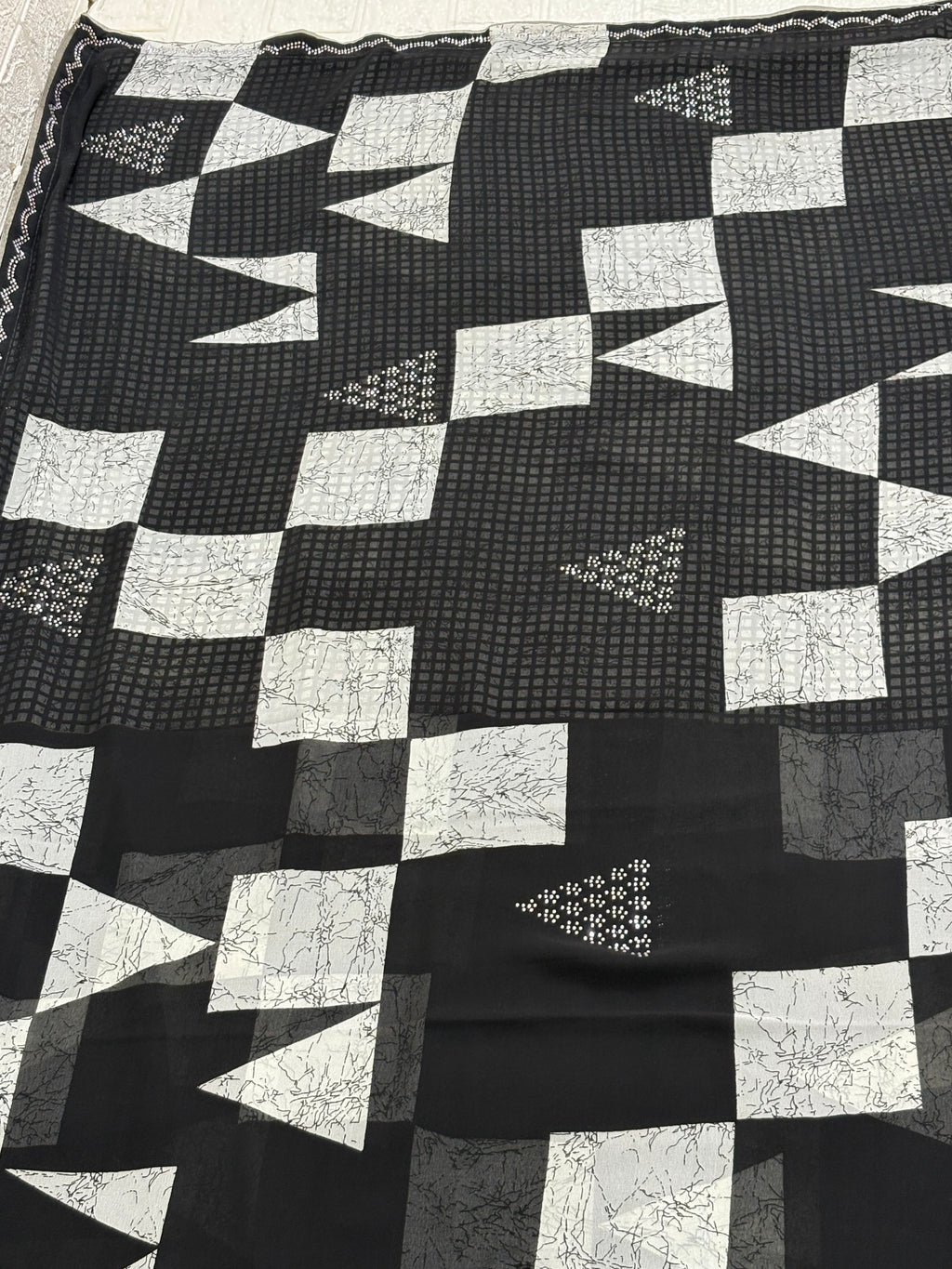 Name: Monochrome Geo Saree fabric pure georgette blend featuring geometric block patterns and subtle sequin accents for a chic contemporary look.