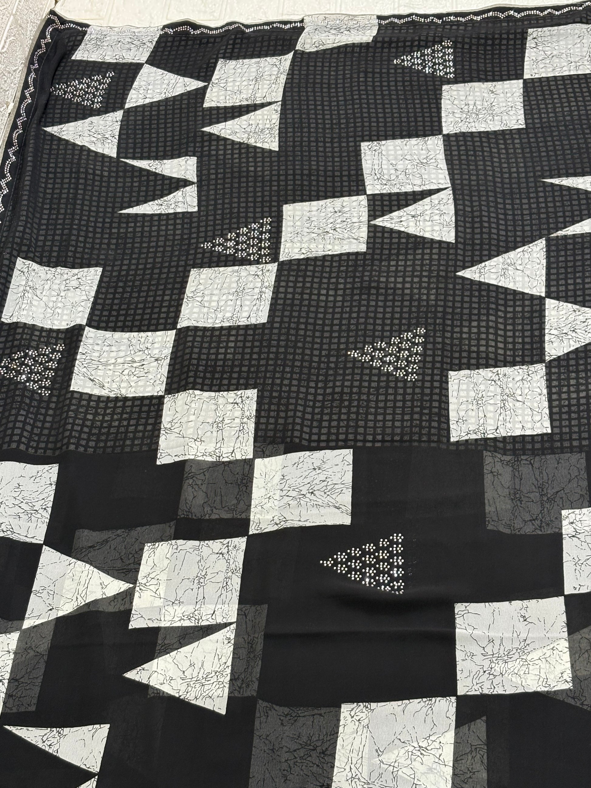 Name: Monochrome Geo Saree fabric pure georgette blend featuring geometric block patterns and subtle sequin accents for a chic contemporary look.