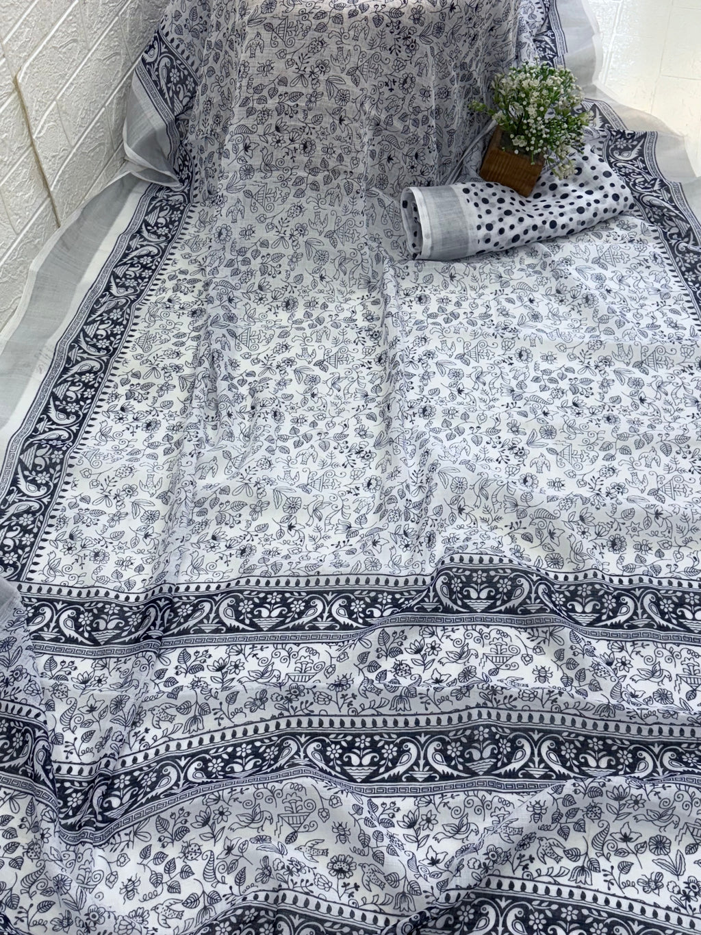 Cotton saree white and blue midnight colour silver colour zari border and peacock & floral motifs silver border often called a checked  Patola design