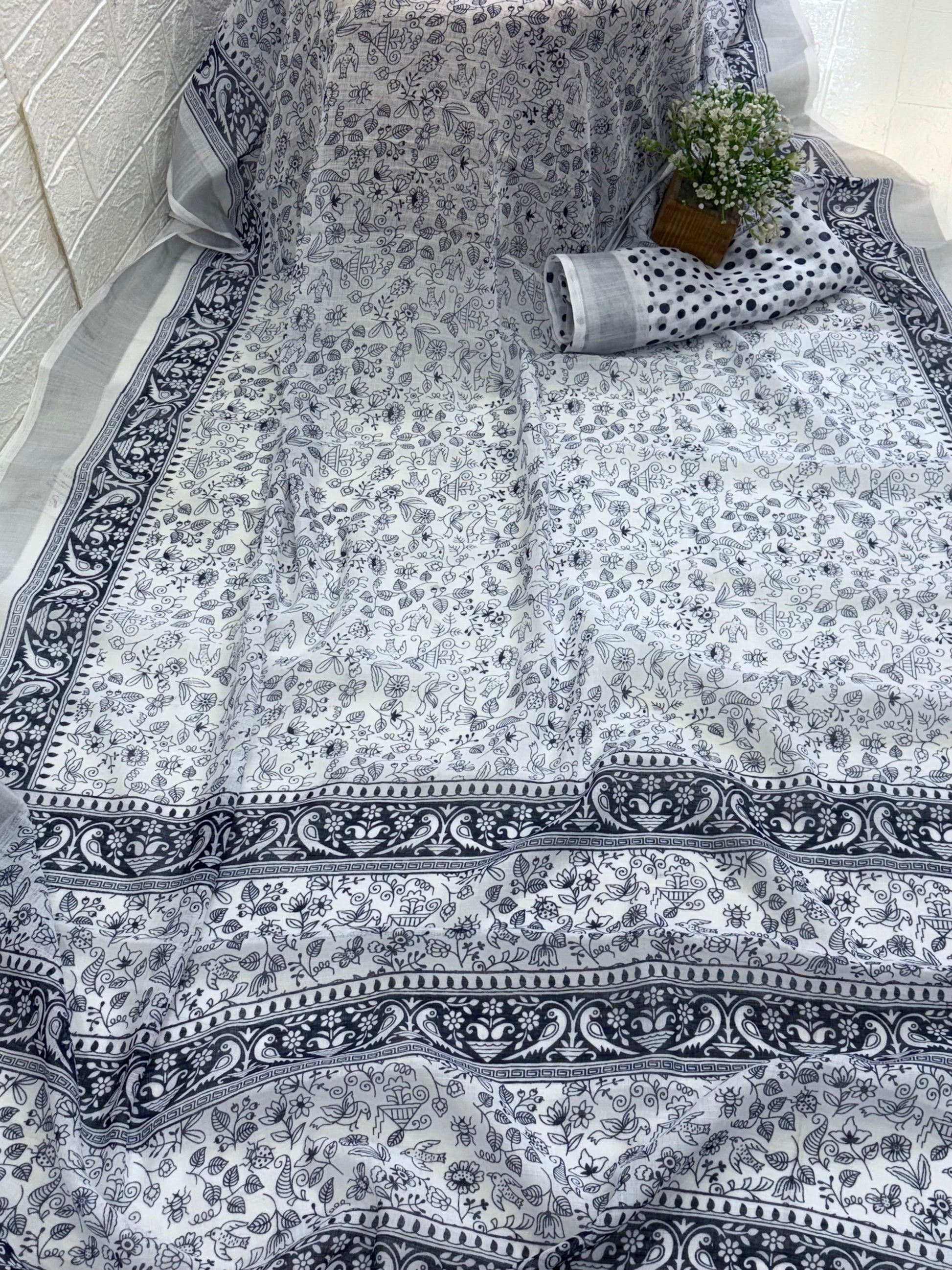 Cotton saree white and blue midnight colour silver colour zari border and peacock & floral motifs silver border often called a checked  Patola design