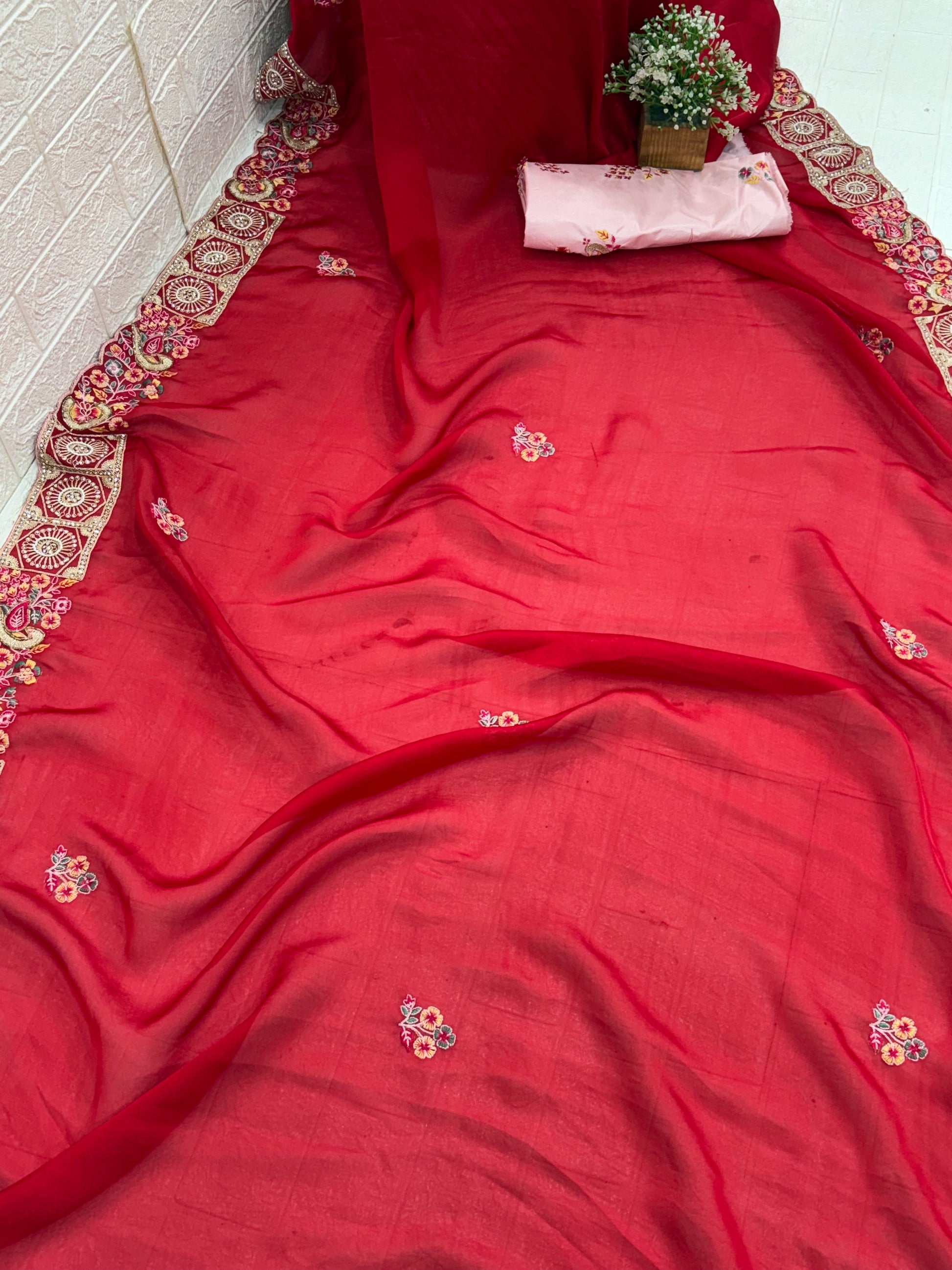 Name: Crimson Blossom saree Lightweight chiffon red colour with delicate floral embroidery and intricate border detailing.