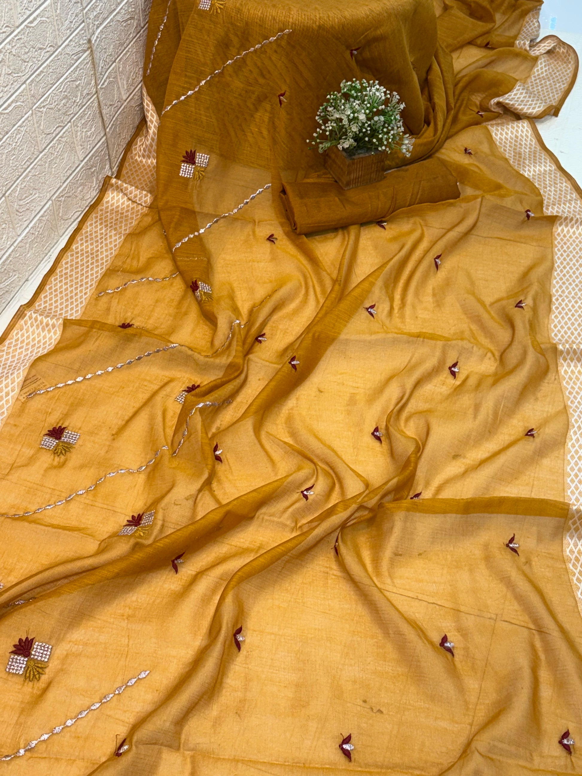 Yellow Mustard Handloom Saree handwoven cotton highlighted with subtle embroidered motifs and a classic textured border for an elegant everyday look.