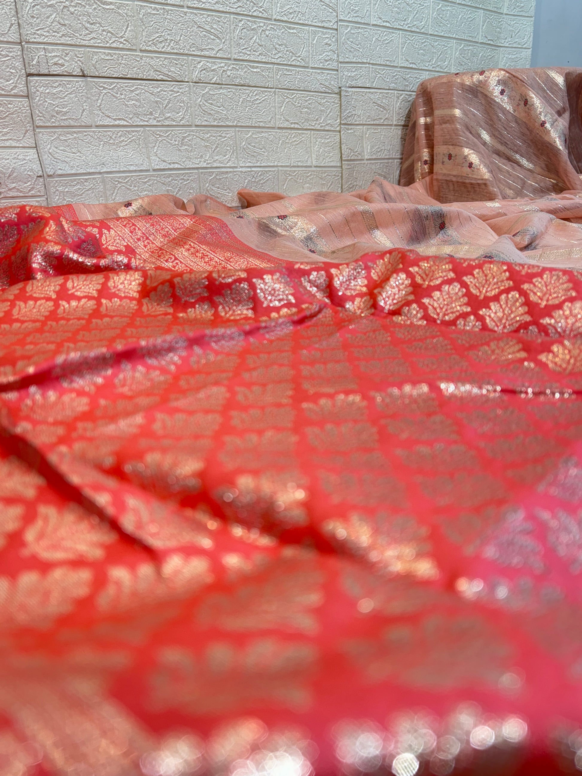 Peach Zari Grace Soft cotton saree with shimmering zari stripes, tiny floral motifs, and a rich coral-toned woven zari border for an elegant festive look.