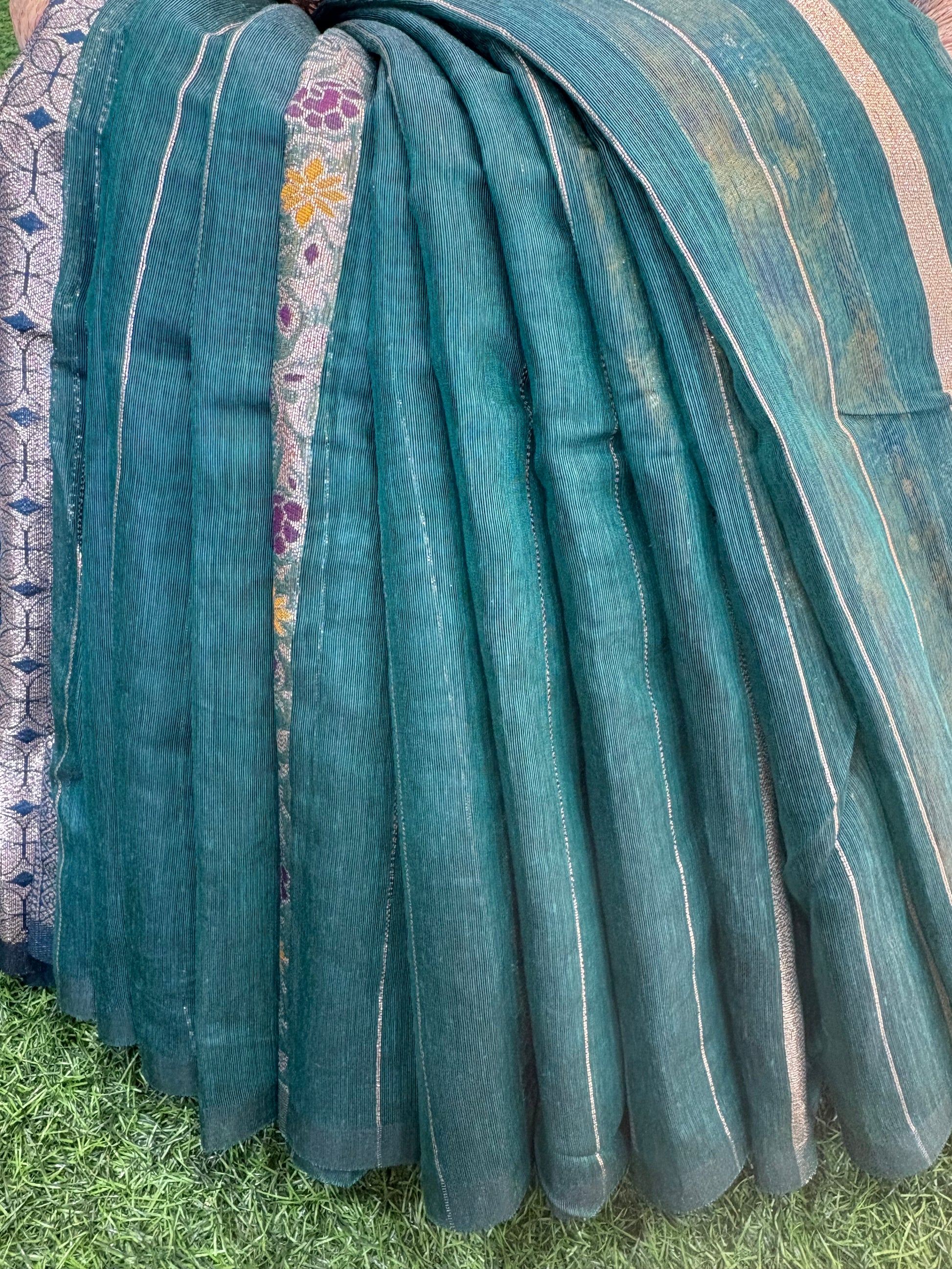 Teal green Garden Zari Classic Lightweight soft cotton saree featuring fine zari stripes, floral motif accents, and an elegant richly woven zari pallu and border.
