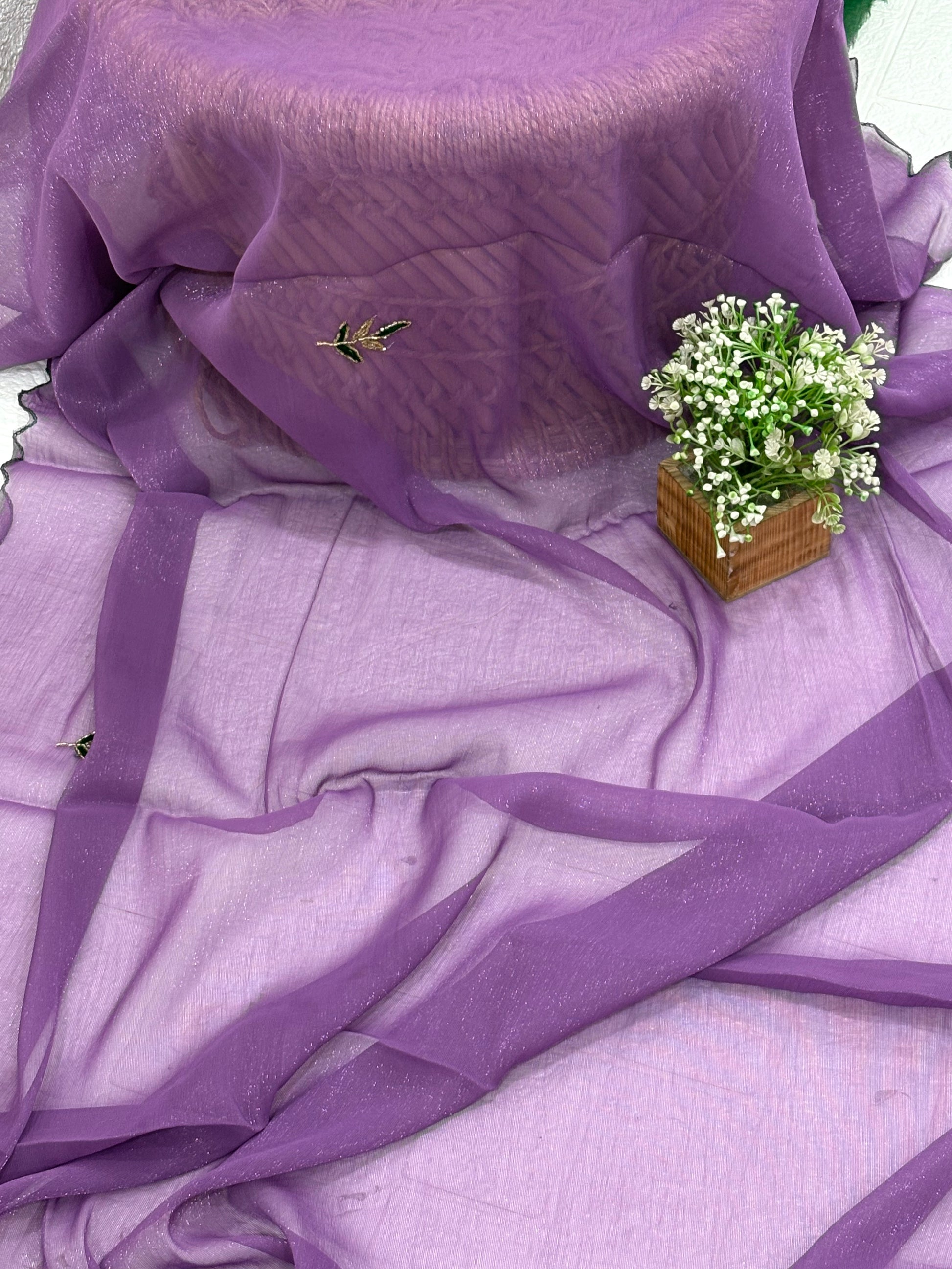 Name: Lavender Charm Ensemble Lightweight soft  shimmer organza fabric with delicate thread embroidery and shimmer detailing, paired with a Green blouse and a giving it a graceful drape