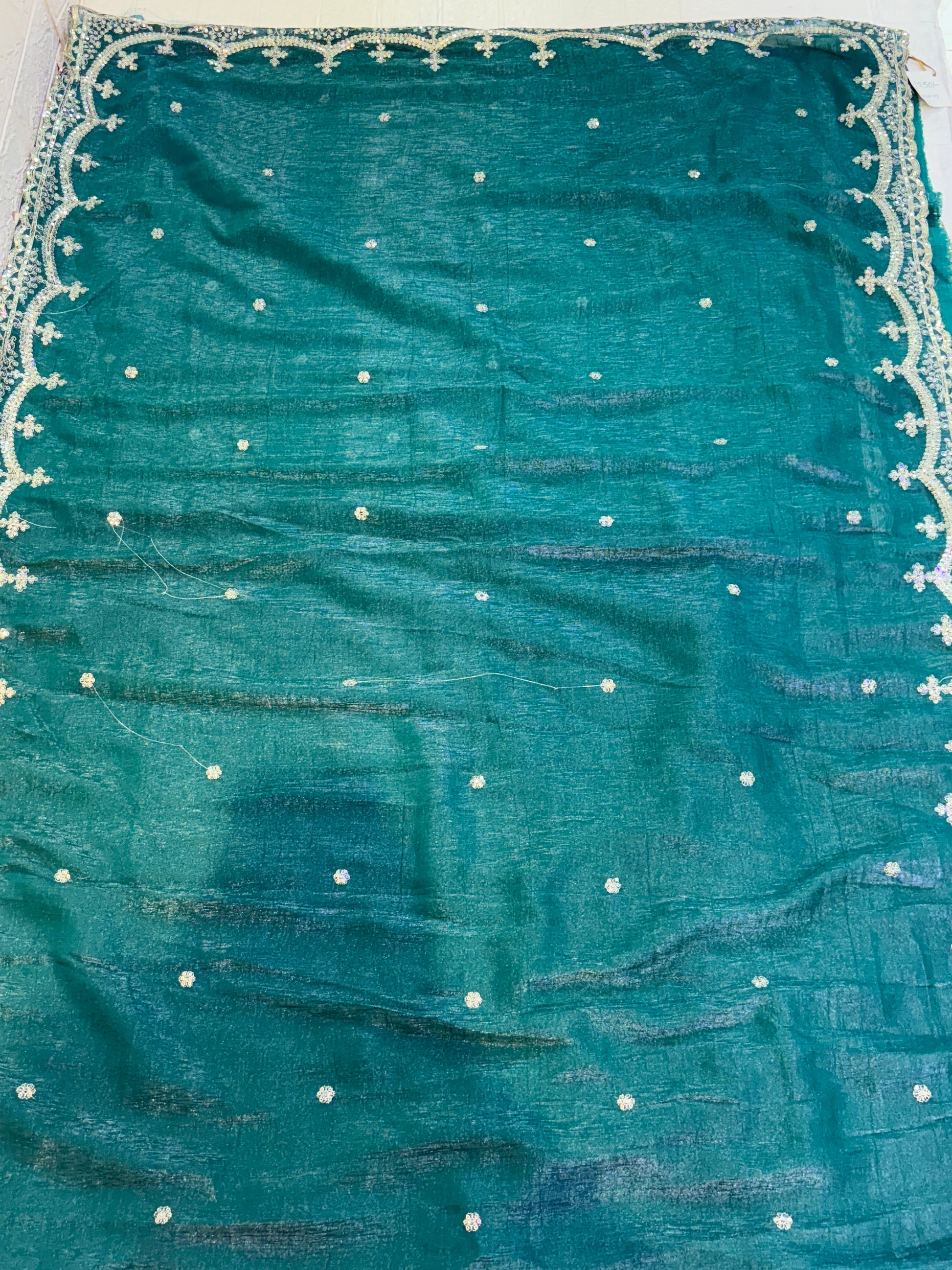 Name: Teal Green burberry silk Saree Elegant with delicate pearl and sequin floral embroidery along the border and scattered motifs across the drape.
