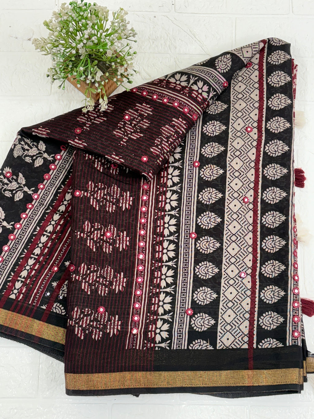 Name: Ebony Block Print Saree
Fabric: Pure cotton with traditional block print motifs, mirror embellishments, and a gold zari border for a classic ethnic charm.