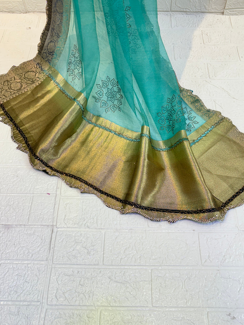 Name: Sea Green cotton silk Saree Lightweight silk with intricate sequin floral motifs and rich zari-woven border, perfect for elegant festive wear.