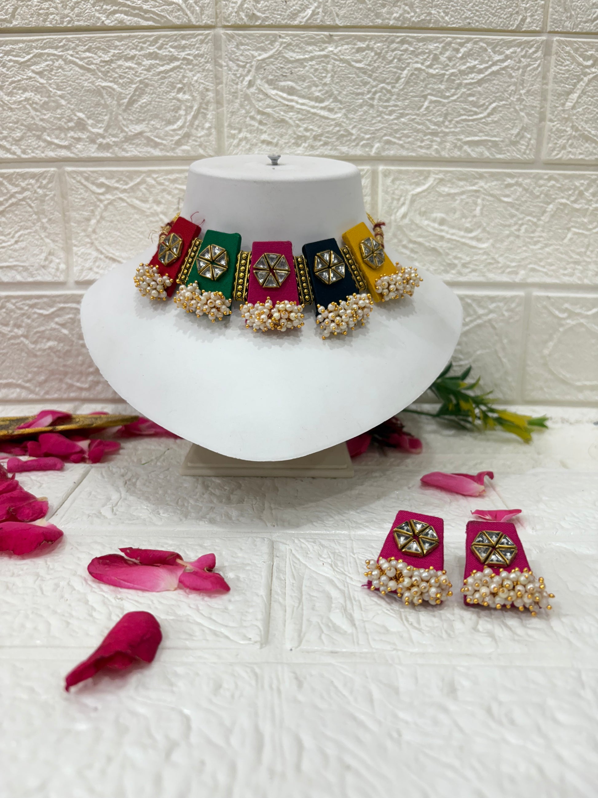 Multicolor Fabric Choker Set with Mirror Work & Pearl Drops

Collection:
Festive & Navratri Special Jewelry Collection

This name highlights the multicolor panels, mirror detailing, and pearl embellishments — making it perfect for traditional, festive, or