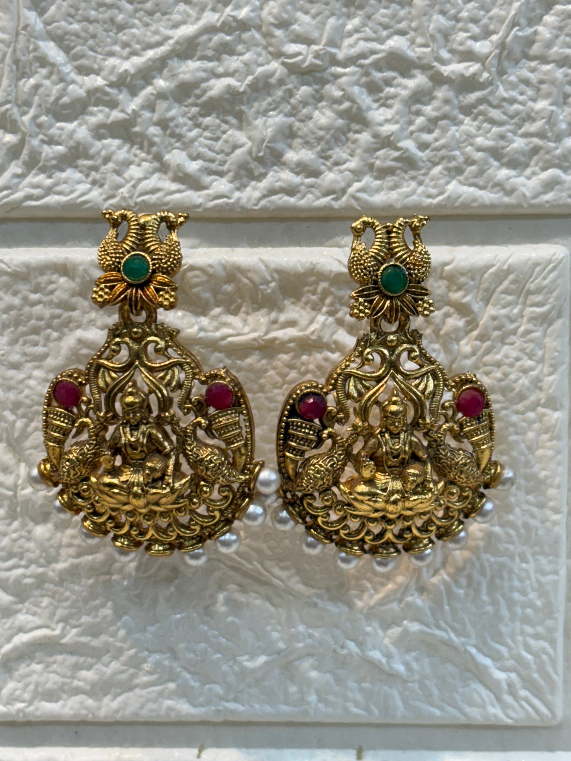 Traditional South Indian temple jewellery featuring Goddess Lakshmi motifs, floral links, and pearl drops—perfect for weddings, festive occasions, and classical saree looks.