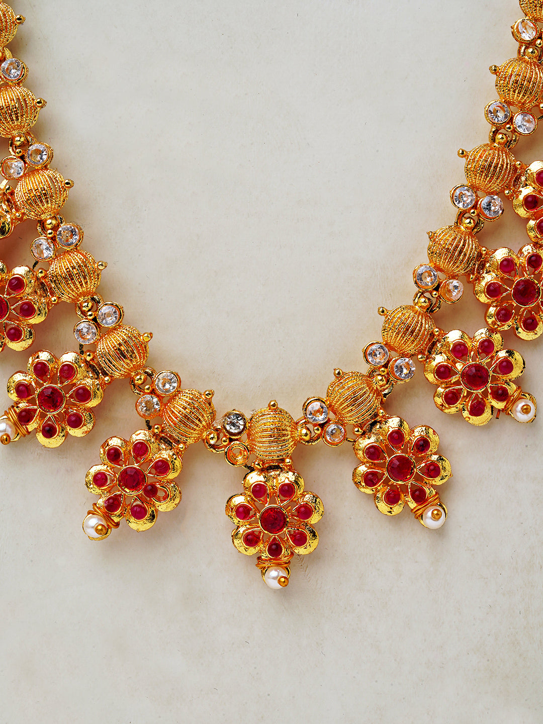 Traditional Temple-Inspired Gold Necklace Set with Red Stone Floral Motifs
