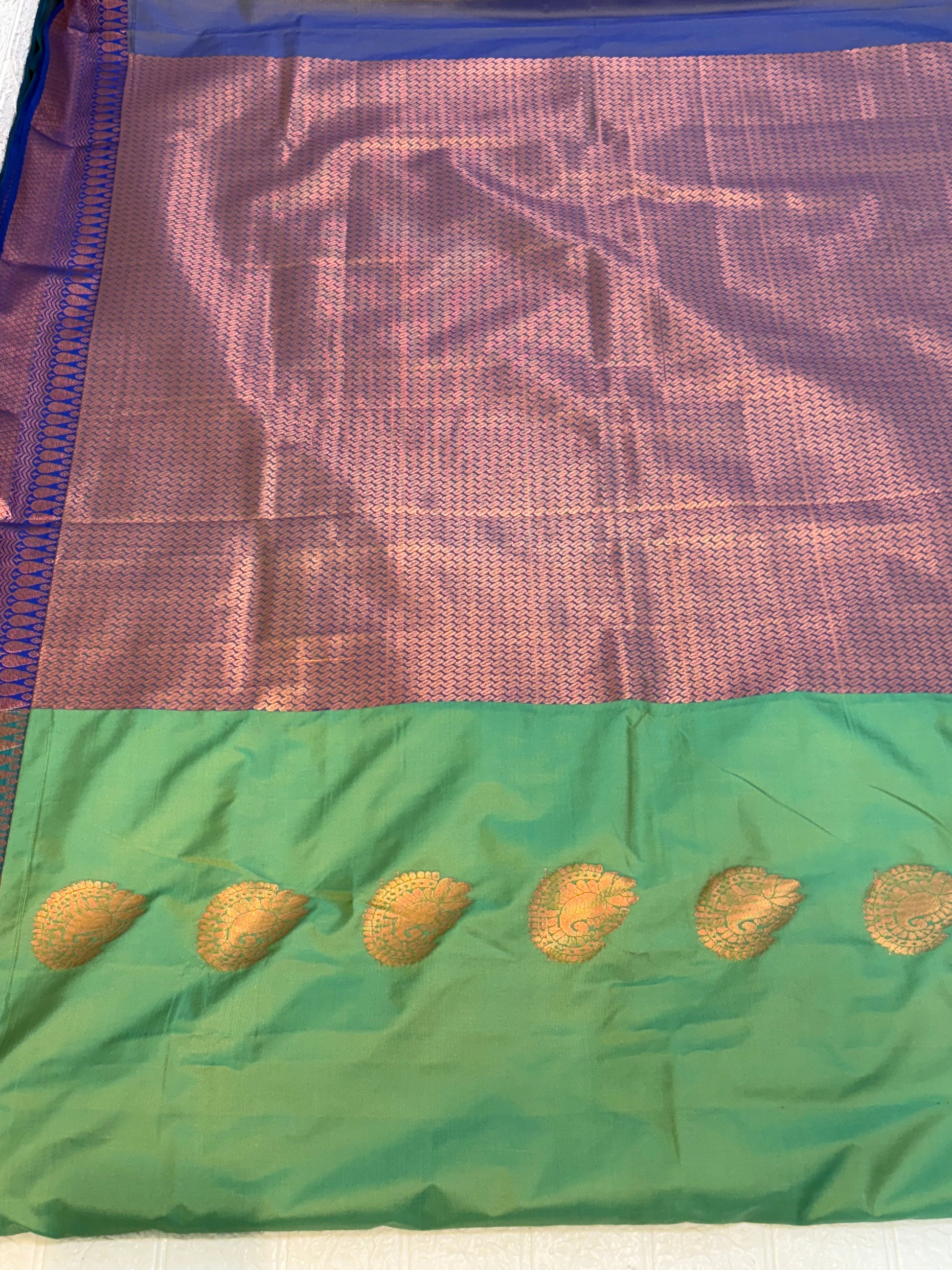 Name: Green pure Silk Saree with Rich Zari Weaving and purple pallu and contrast Border