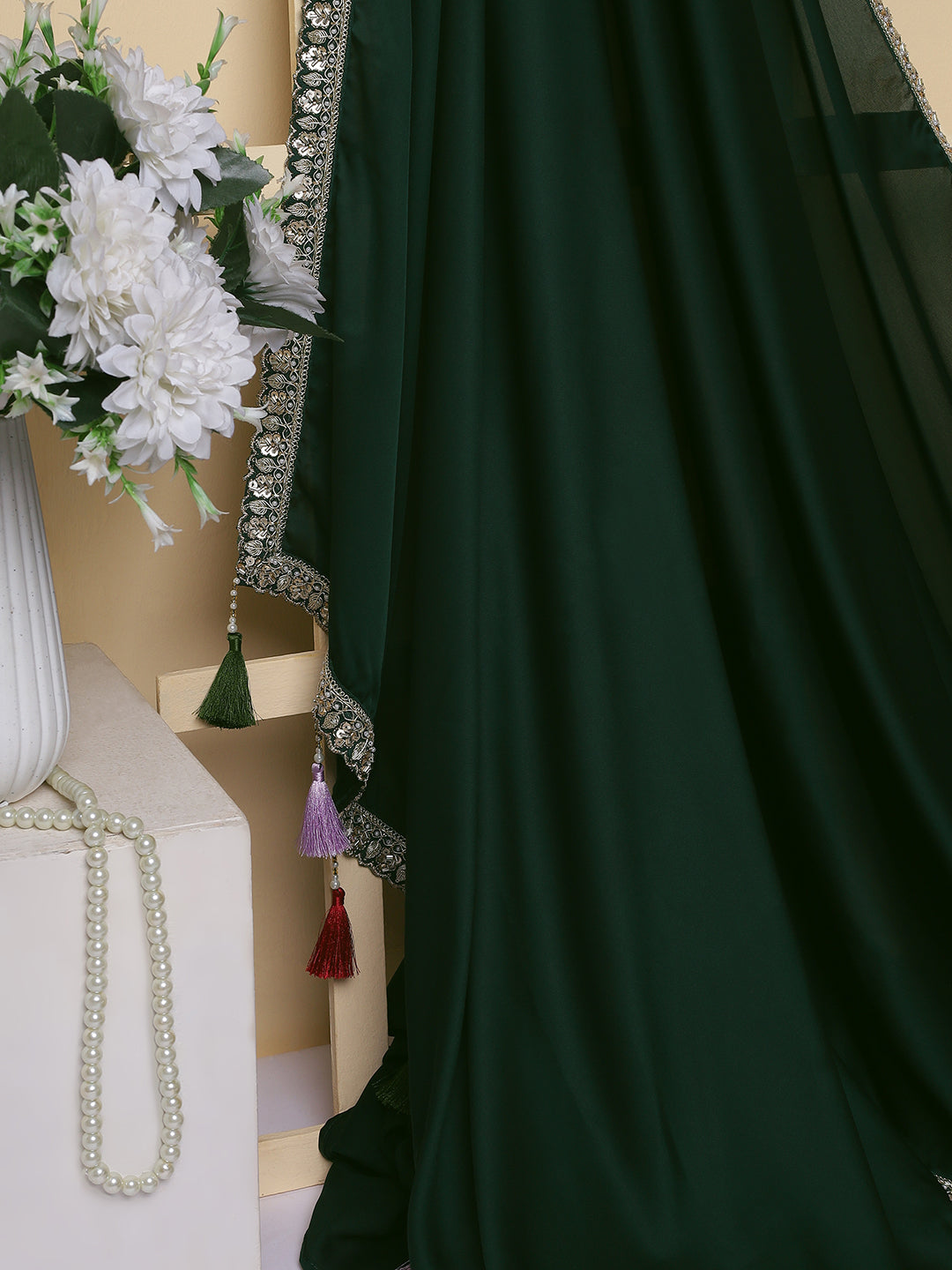 Emerald Green Georgette Saree with Sequined Border & Multi-Colored Tassels