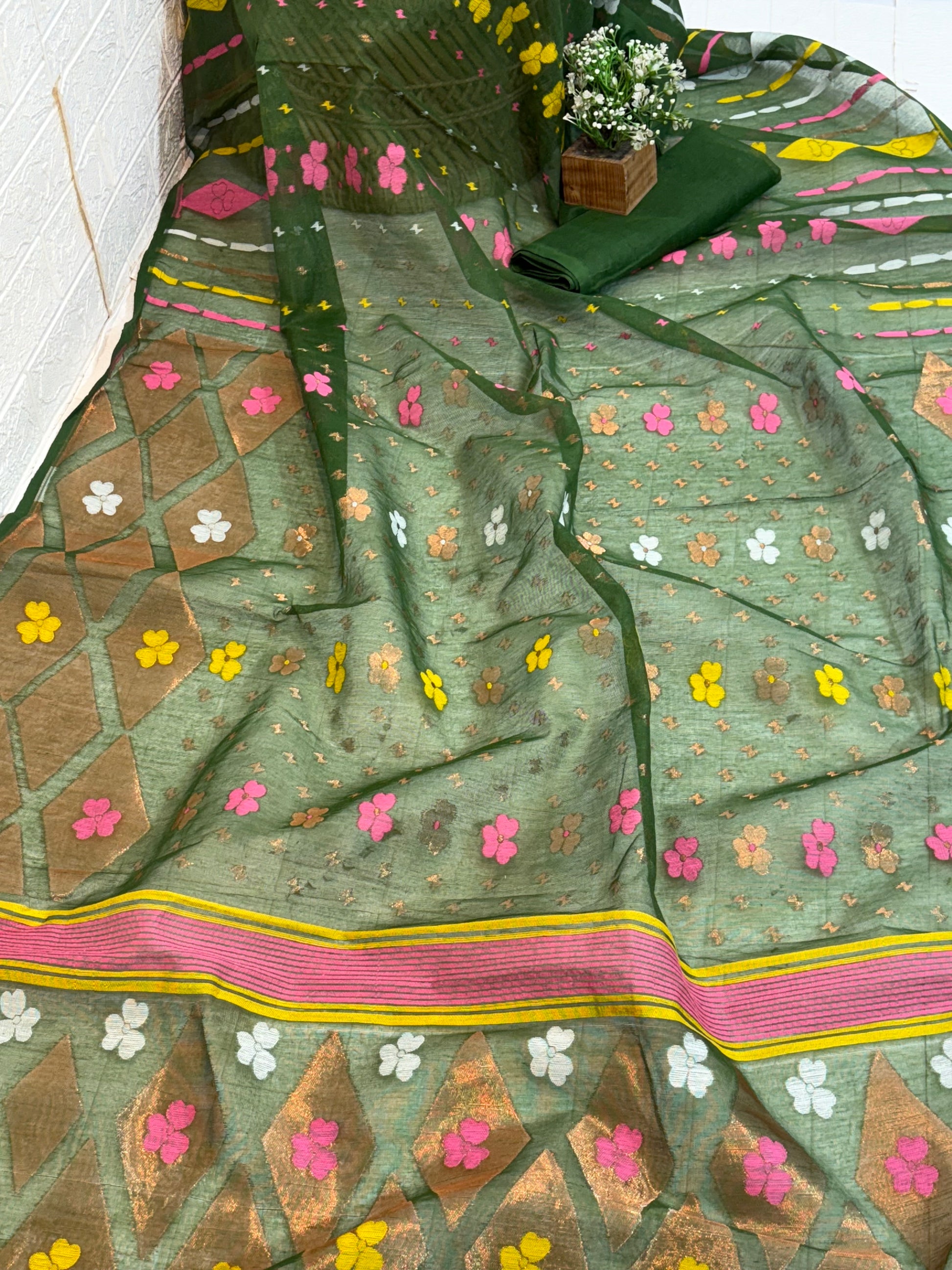 Soft cotton Jamdani, adorned with delicate floral motifs and a traditional woven border, light and breathable for all-day elegan