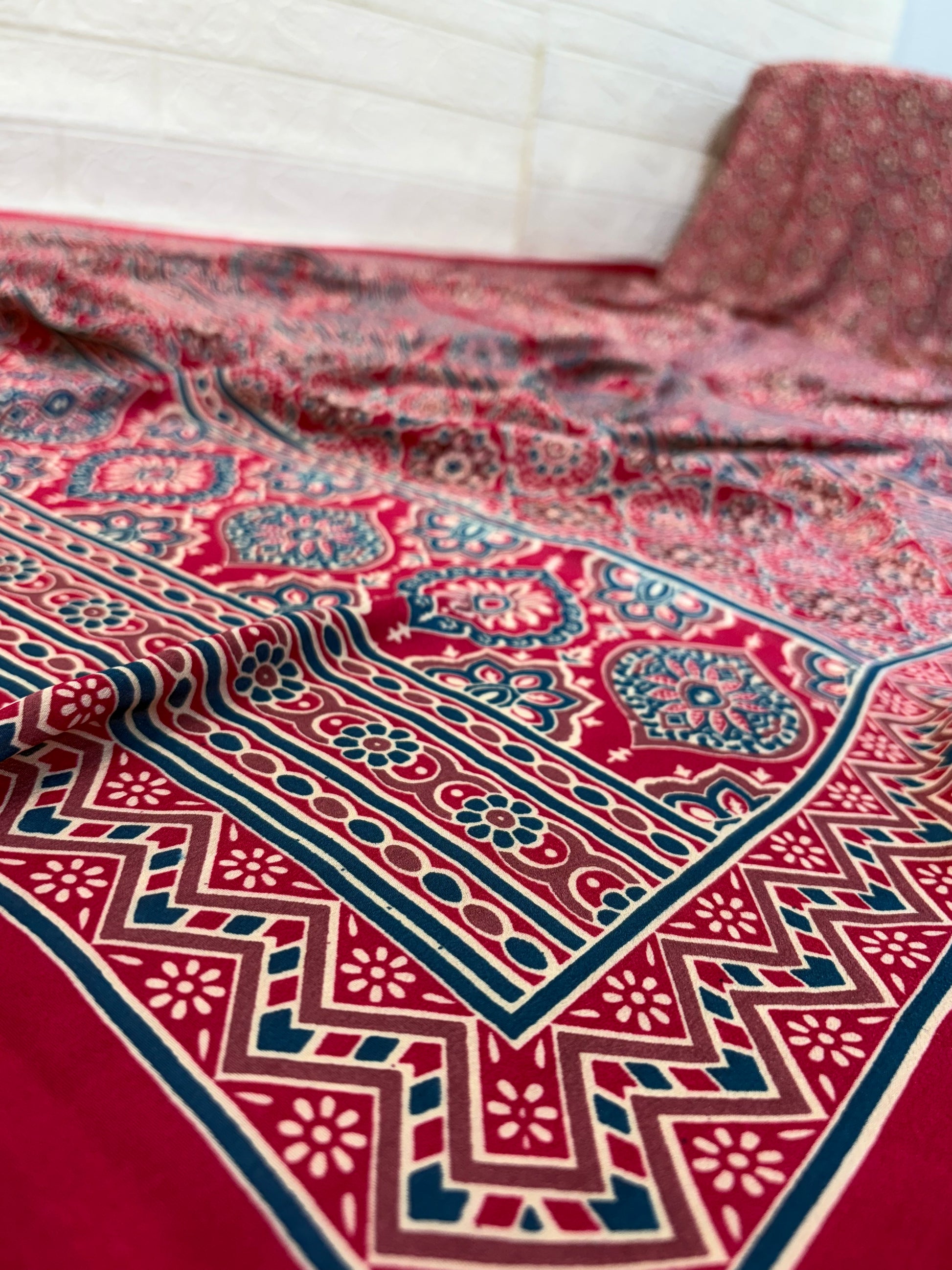 Maroon Ajrakh Motif Saree
Crafted in soft crepe fabric, this saree features traditional Ajrakh-inspired geometric prints with a classic border, offering comfort with timeless ethnic charm.