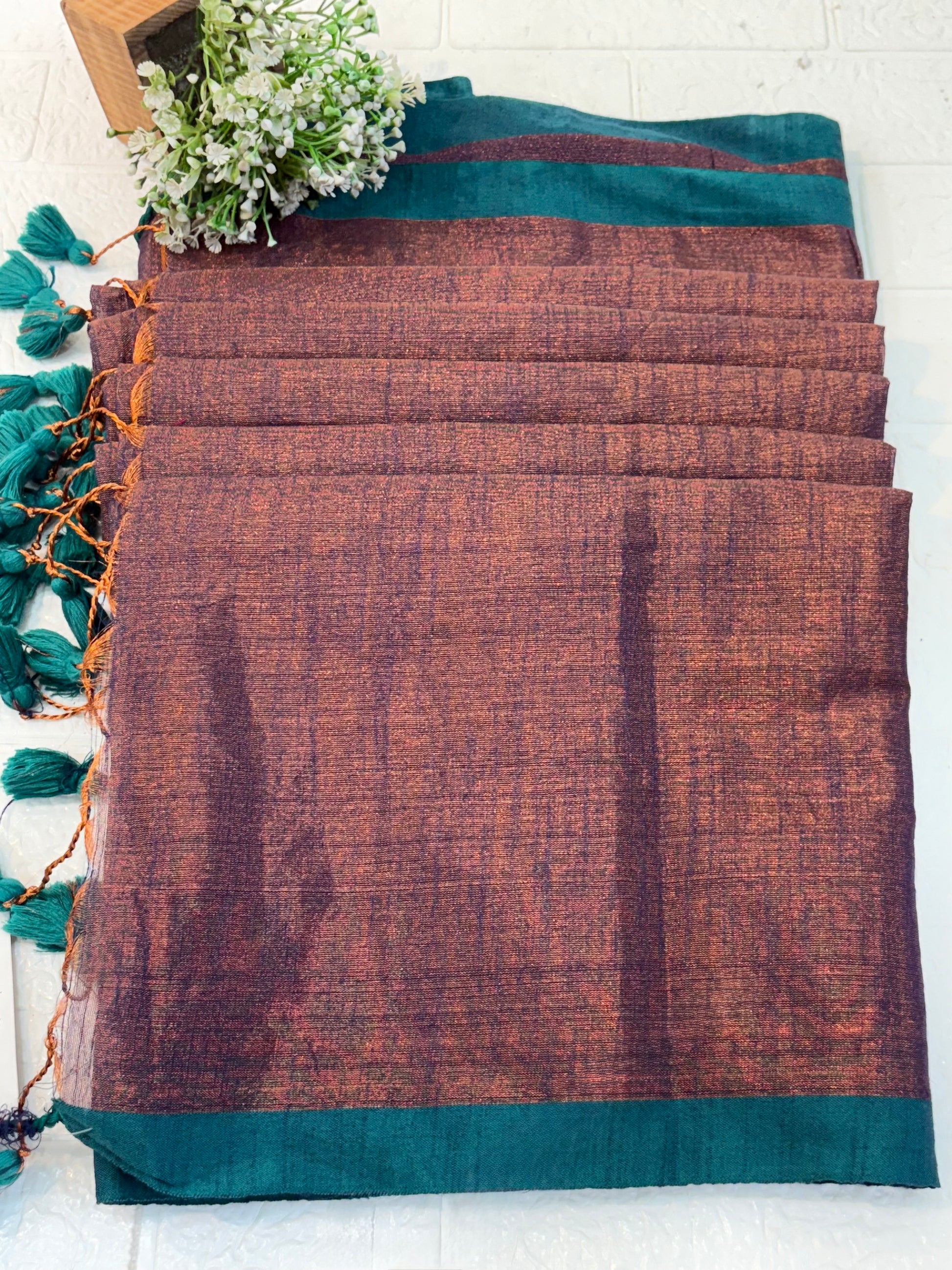Name: Dual Tone  cotton shimmering Silk Saree Pure with a subtle copper and violet sheen, featuring a green border.