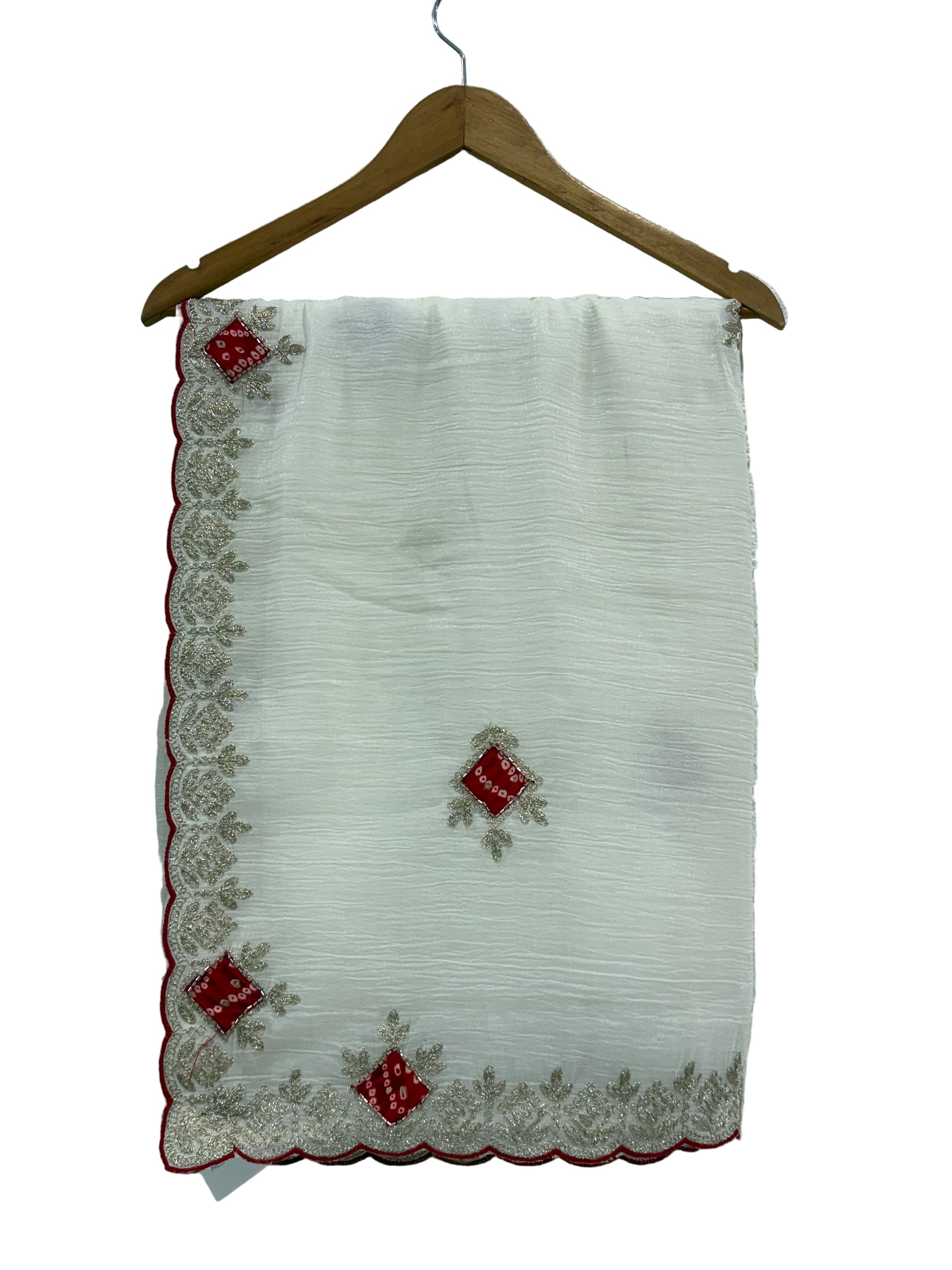 Name: Ivory Grace saree 
Elegant crush chinon fabric saree with red bandhej-style motifs and zari embroidered border. Bandhni-style blause fabric