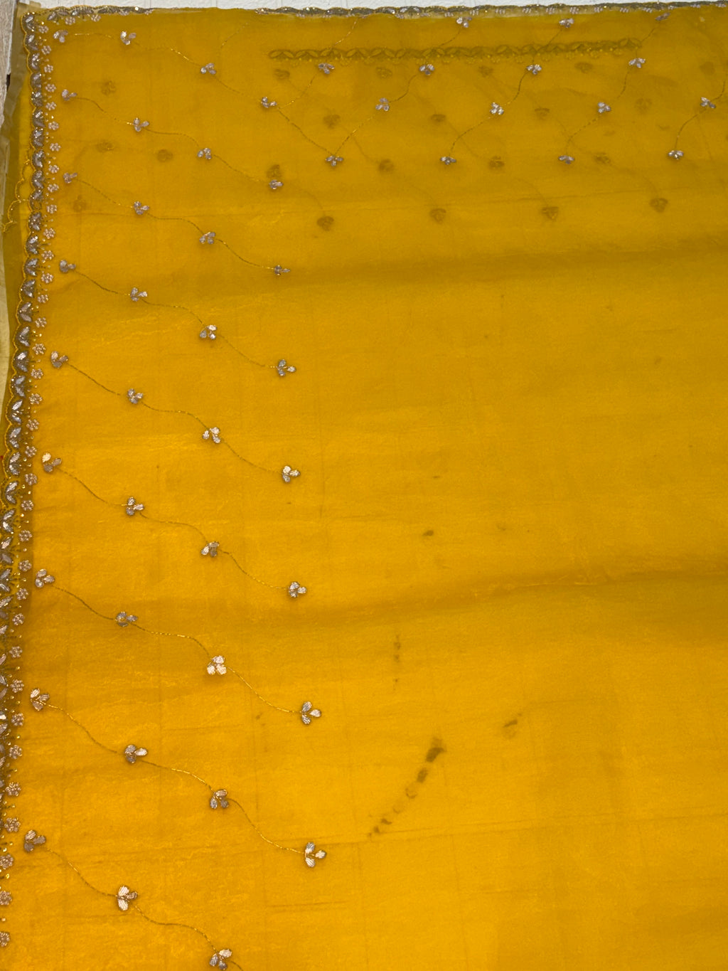 Fabric Soft pure organza adorned with mustard yellow colour delicate floral sequin embroidery and scalloped zari border and Maching blouse with embroidery