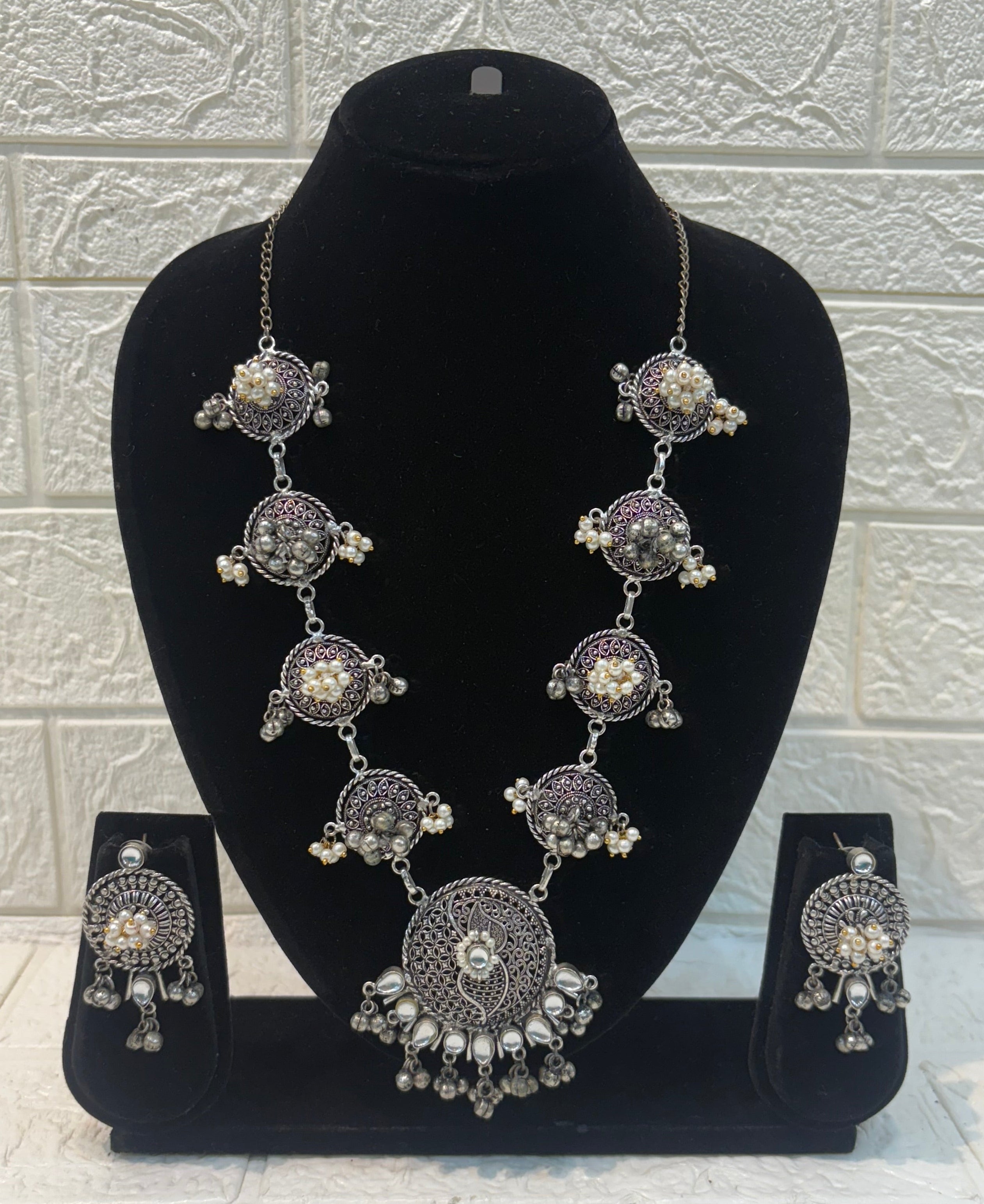 Name: Antique Oxidized Circular Necklace Set German silver with intricate filigree work and pearl bead detailing