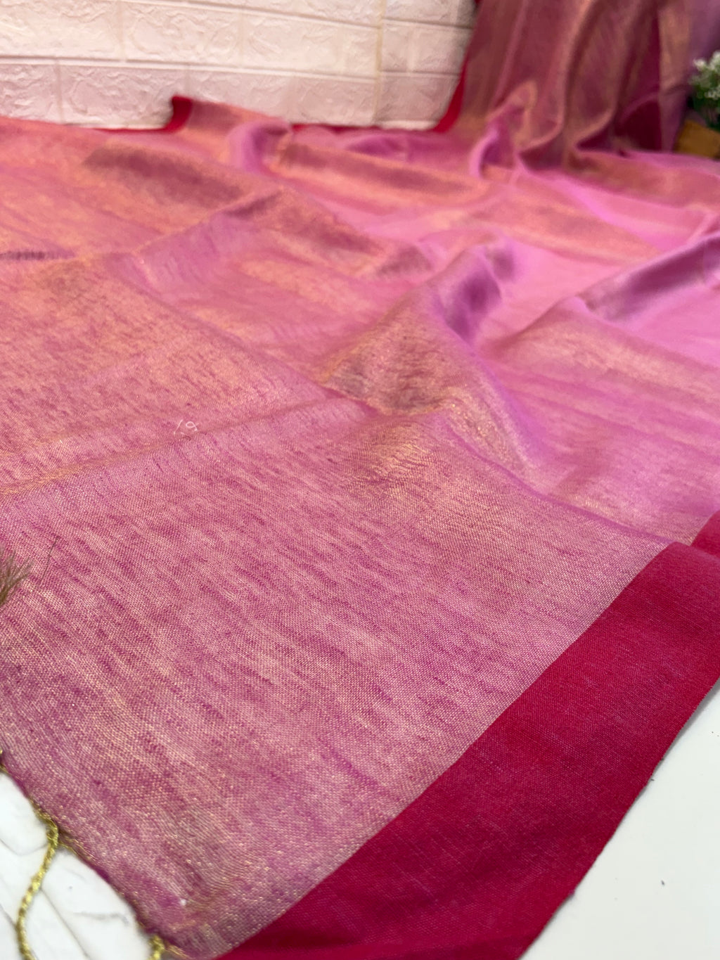 Name: Rose Gold cotton  shimmering Silk Saree with a soft rose-pink and golden sheen, finished with a deep maroon border.