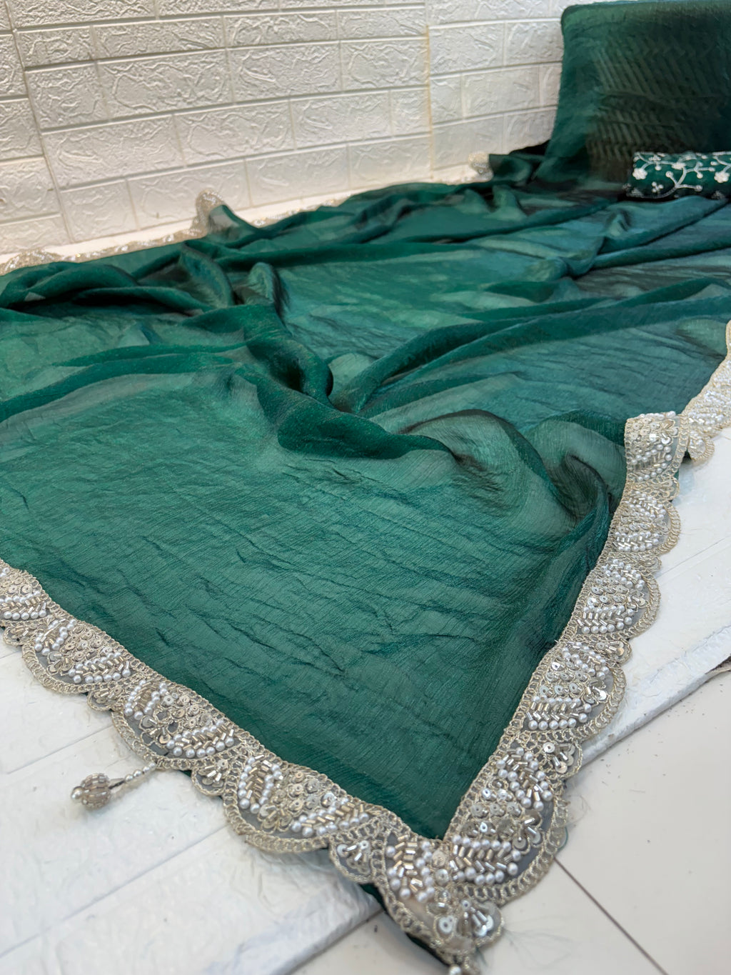 Name: Emerald bottle green colour Saree crush organza fabric with Embroidered Blouse with a soft shimmer finish and thread embroidery blouse piece