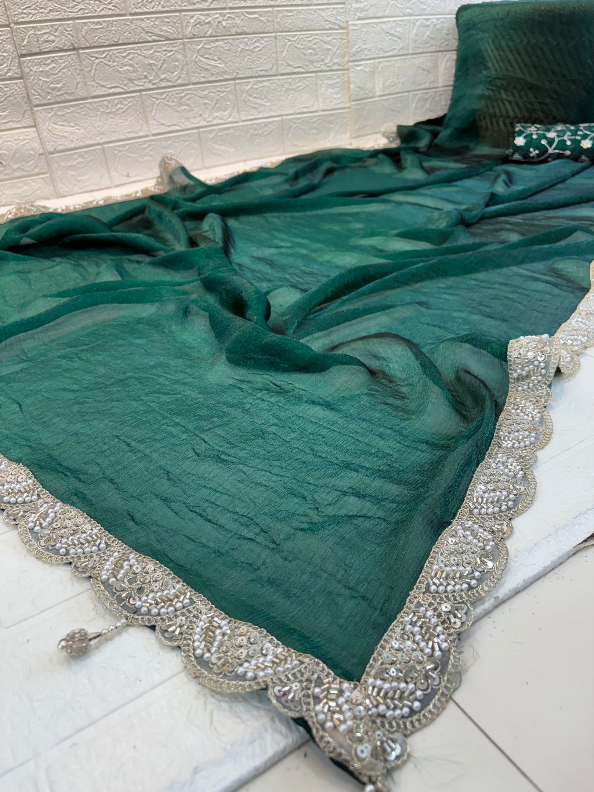 Name: Emerald bottle green colour Saree crush organza fabric with Embroidered Blouse with a soft shimmer finish and thread embroidery blouse piece