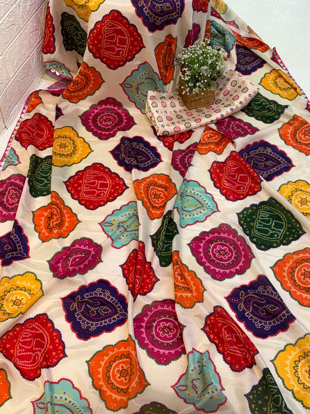 Name: Multicolor Bandhani Print Saree chinon fabric blend with vibrant traditional bandhani motifs, offering a festive and colorful ethnic appeal.