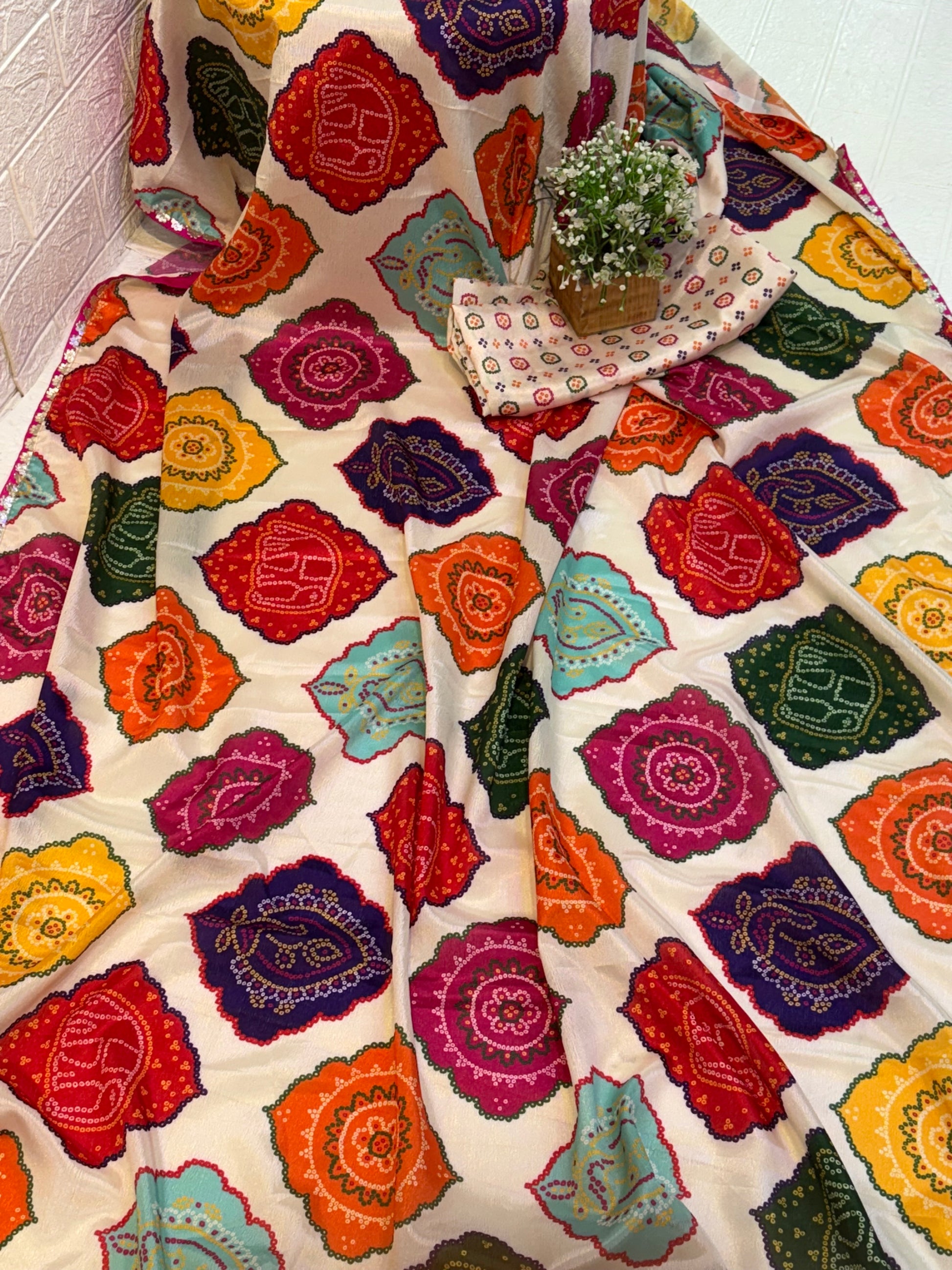 Name: Multicolor Bandhani Print Saree chinon fabric blend with vibrant traditional bandhani motifs, offering a festive and colorful ethnic appeal.