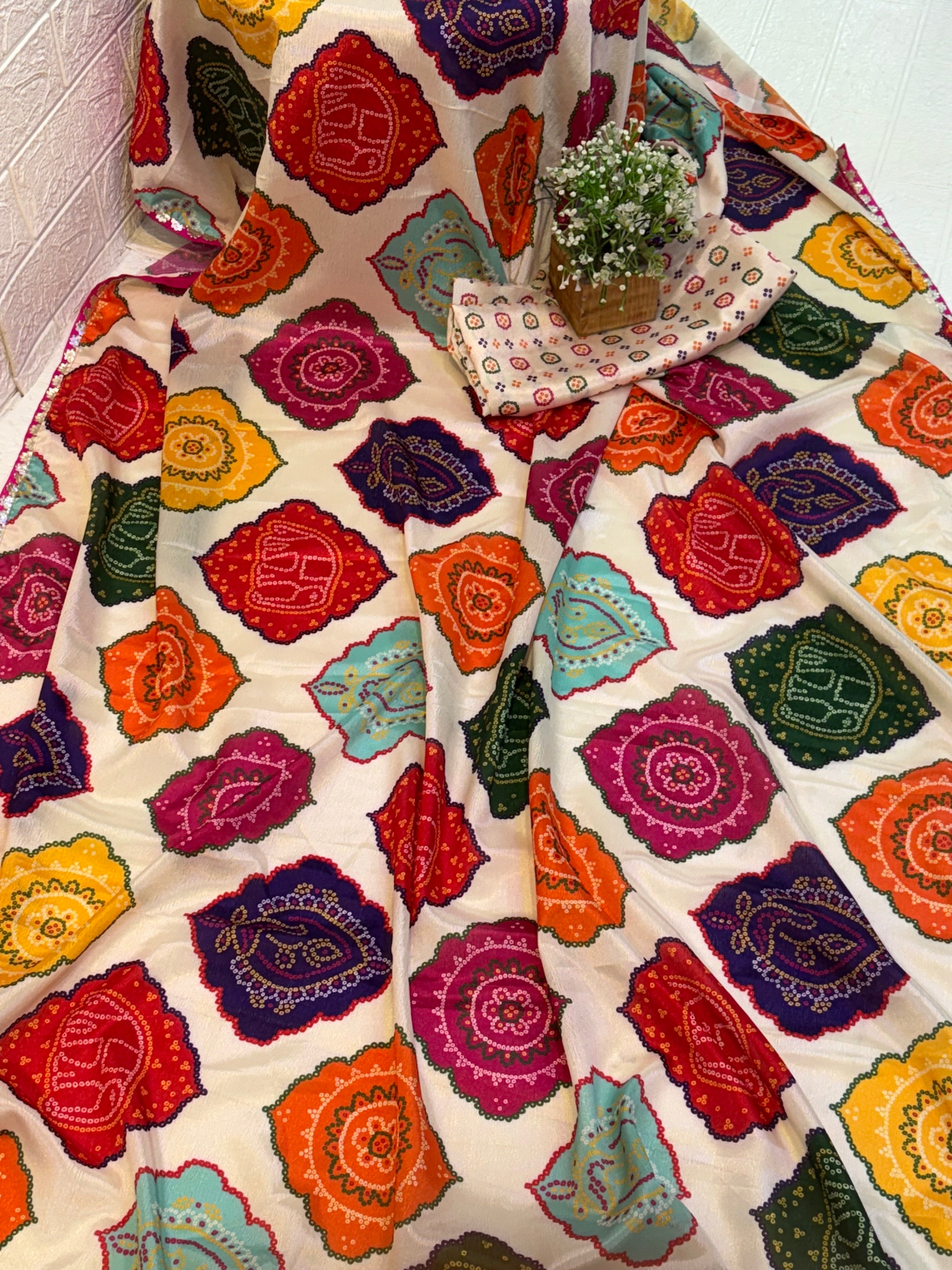 Name: Multicolor Bandhani Print Saree chinon fabric blend with vibrant traditional bandhani motifs, offering a festive and colorful ethnic appeal.