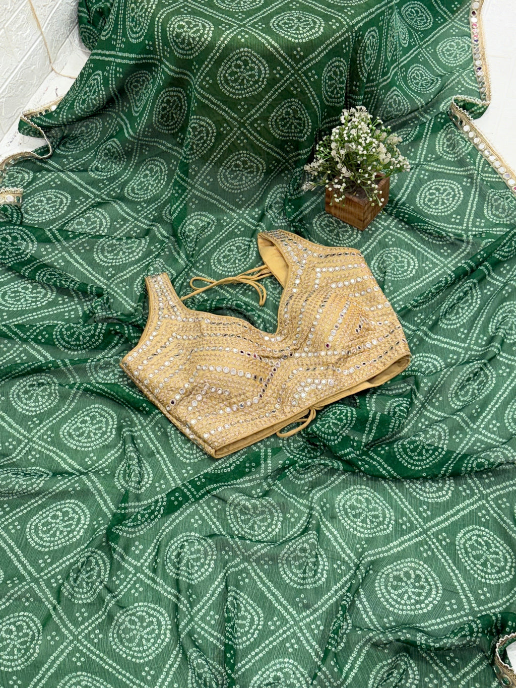 Bandhani Print Fabric crepe Silk Blend with traditional tie-dye pattern and mirror-work golden blouse embellishment.