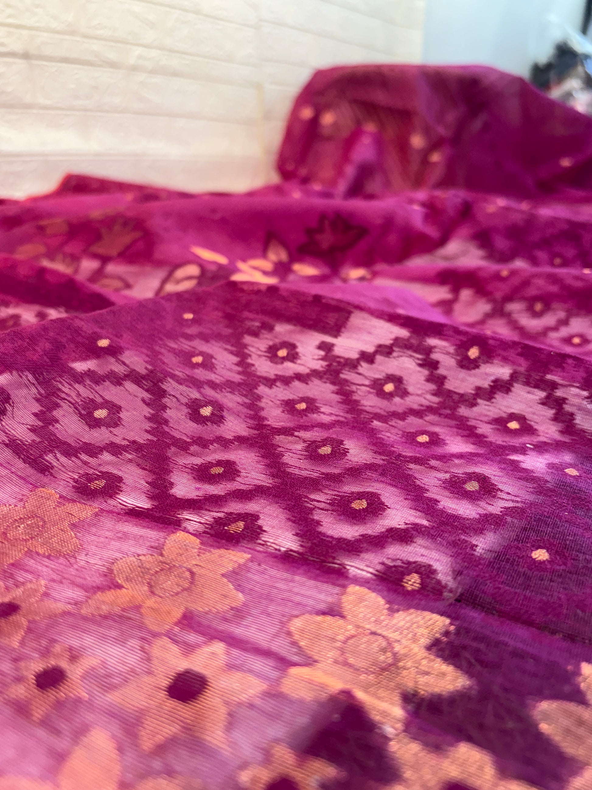 Dark purple Jamdani Saree
cotton, featuring rich geometric and floral woven motifs on a soft, sheer handloom base with an elegant traditional border.