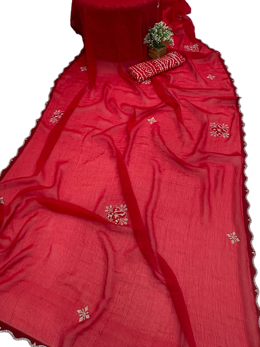 Name: Crimson Blossom Embroidered Saree
Fabric: crepe silk with delicate white thread and Maching Badhani blouse mirror embroidery perfect for festival