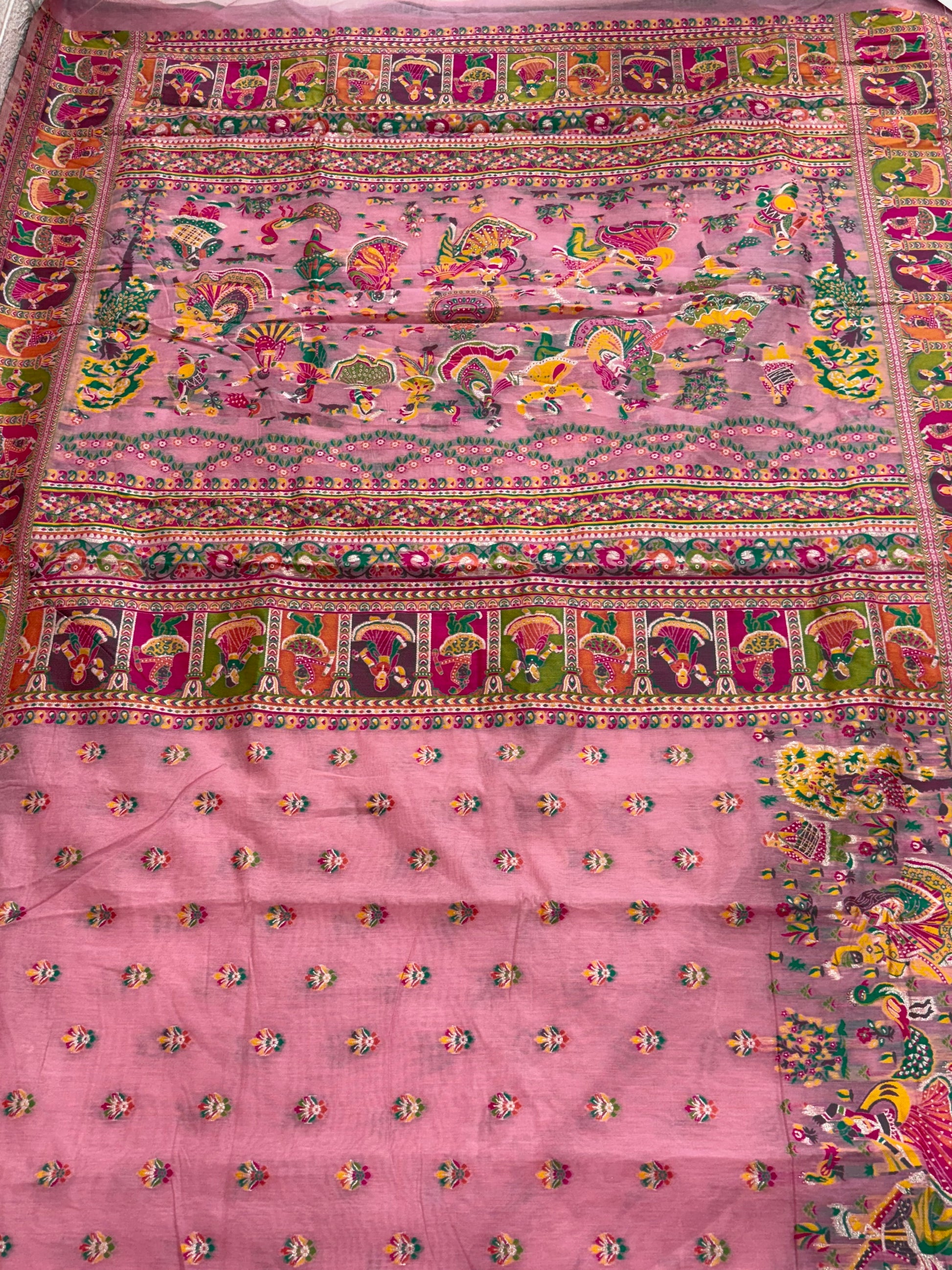 The saree appears to be a Gharchola or a similar style of hand-woven Indian saree, possibly a type of  Chanderi  Silk blend.multicolour in saree and multicolour border best look at festival