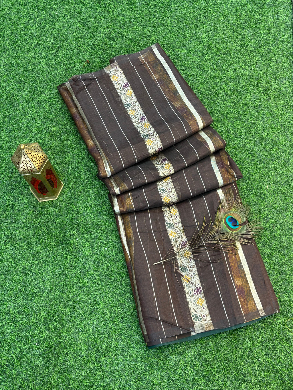 Dark brown zari Elegance Premium soft cotton saree with subtle zari stripes, floral butti accents, and a richly woven antique gold zari pallu and border for a classic, graceful look.