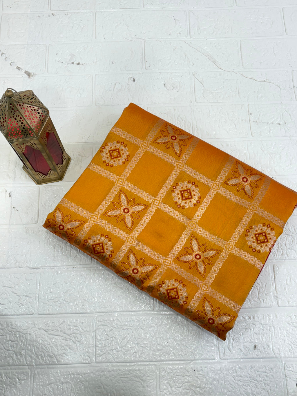 This appears to be a Mustard Yellow Silk Blend or Art Silk Saree/Fabric featuring intricate Zari woven work. The design is a geometric grid or check pattern enclosing distinct floral and circular motifs.