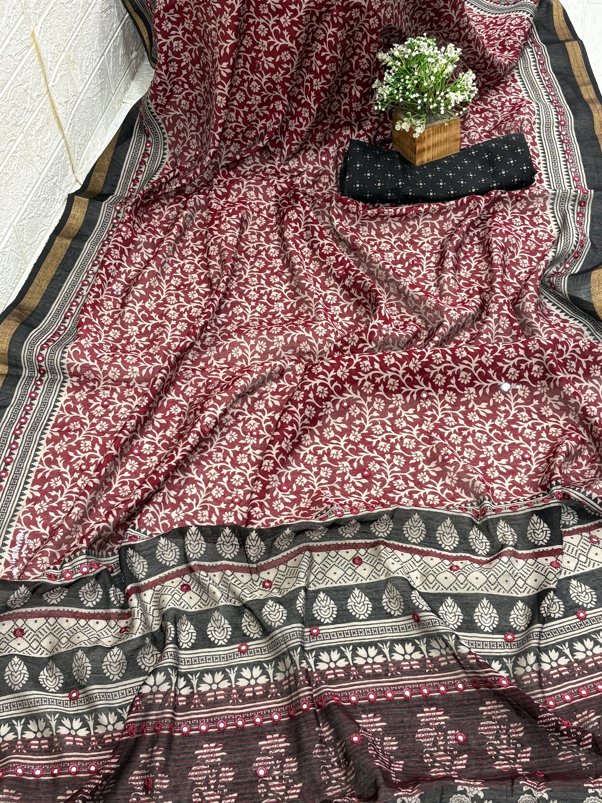 Name: Ebony Block Print Saree
Fabric: Pure cotton with traditional block print motifs, mirror embellishments, and a gold zari border for a classic ethnic charm.