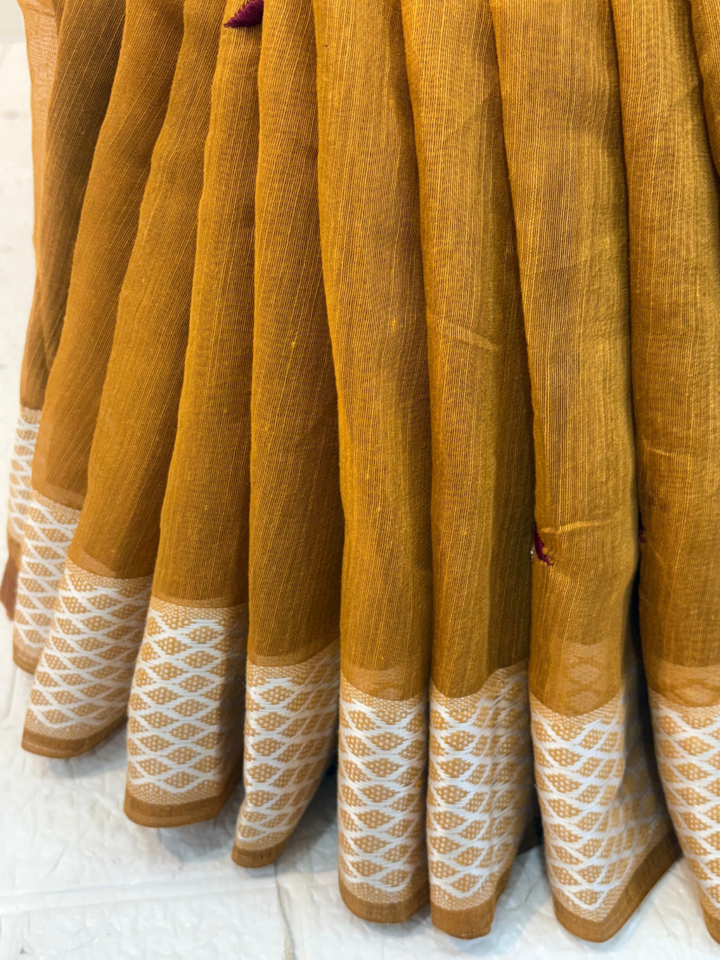 Yellow Mustard Handloom Saree handwoven cotton highlighted with subtle embroidered motifs and a classic textured border for an elegant everyday look.