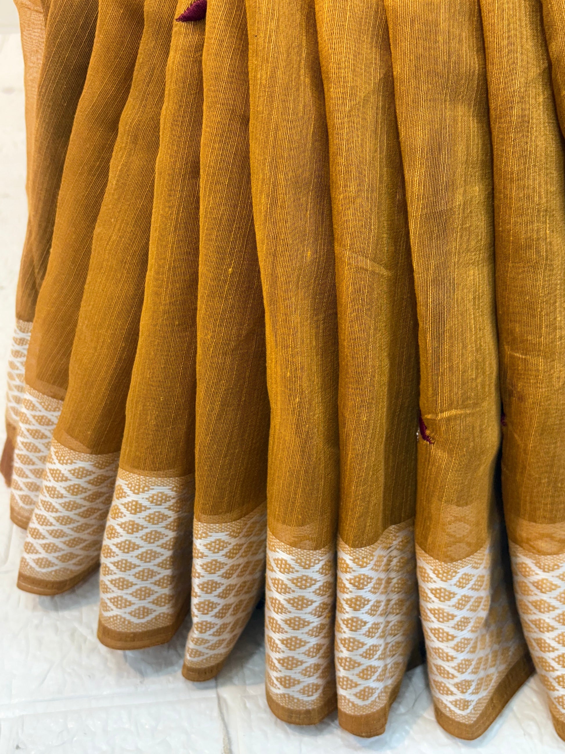 Yellow Mustard Handloom Saree handwoven cotton highlighted with subtle embroidered motifs and a classic textured border for an elegant everyday look.