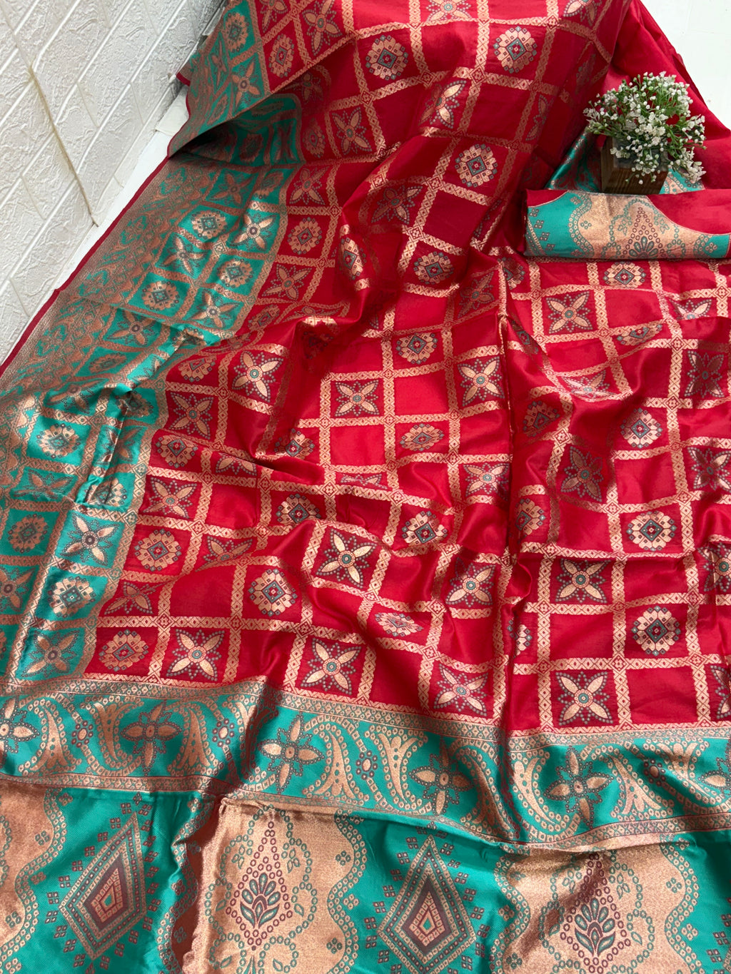Name red saree fabric pure art silk blend adorned with traditional block print motifs and a contrasting tiffany blue border for a timeless ethnic appeal