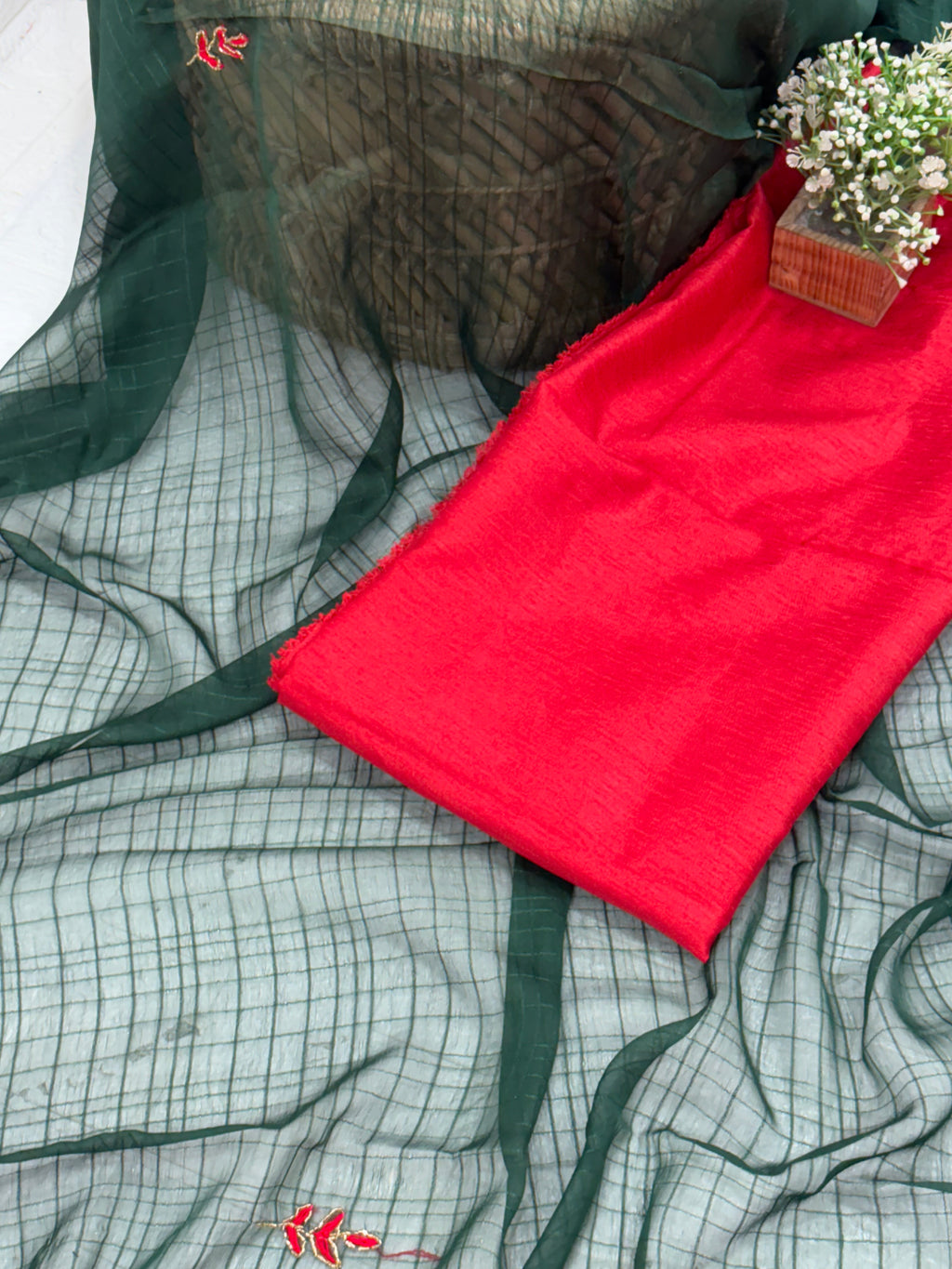 Lightweight green shimmer soft georgette self texture with embroider featuring delicate thread embroidery and red plain blouse perfect for festival