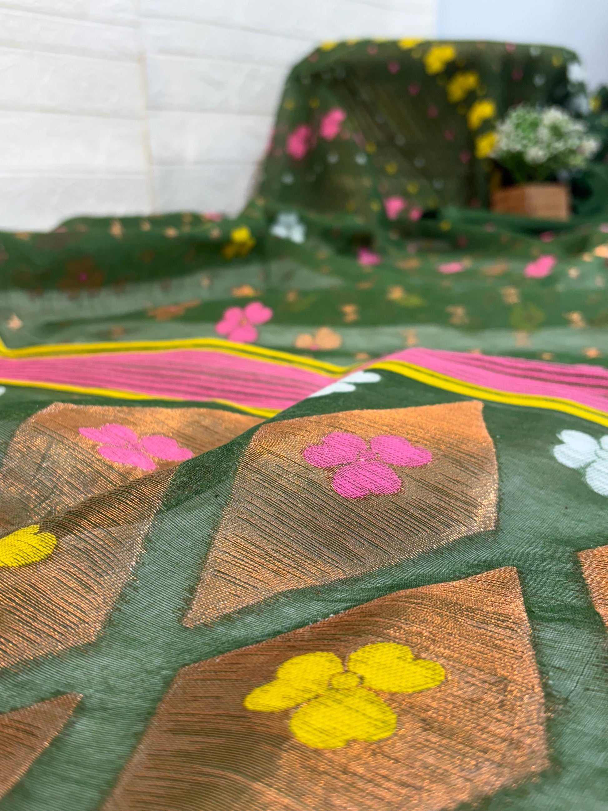 Soft cotton Jamdani, adorned with delicate floral motifs and a traditional woven border, light and breathable for all-day elegan