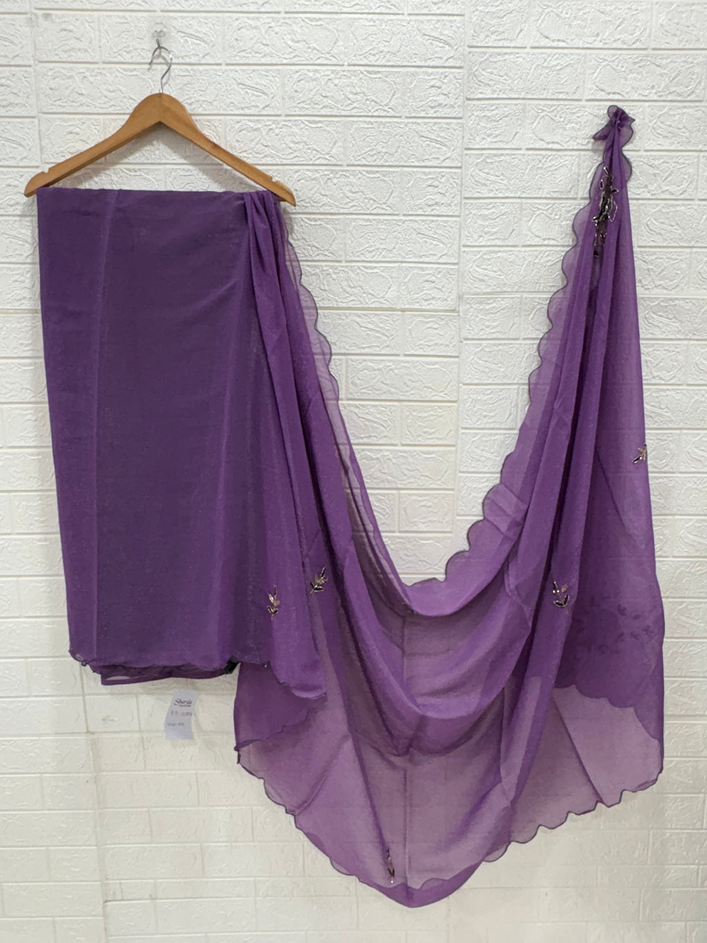 Name: Lavender Charm Ensemble Lightweight soft  shimmer organza fabric with delicate thread embroidery and shimmer detailing, paired with a Green blouse and a giving it a graceful drape