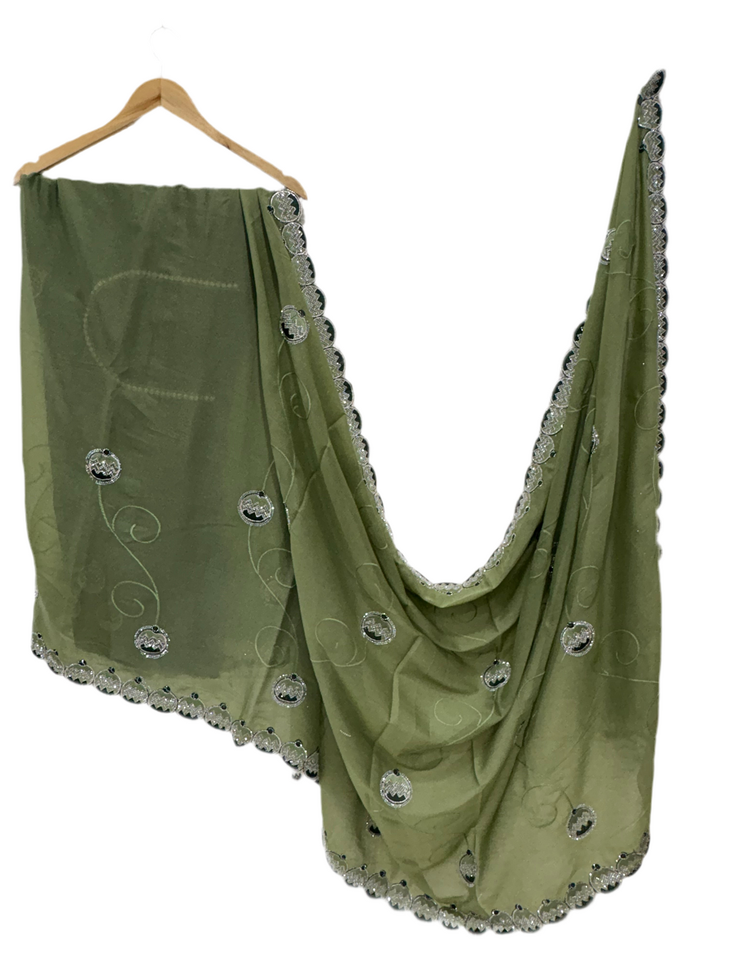 Saree georgette or organza and light mehndi green colour embroidered medallion butti and saree with scalloped border it is a sheer saree with scattered embroider and stonework