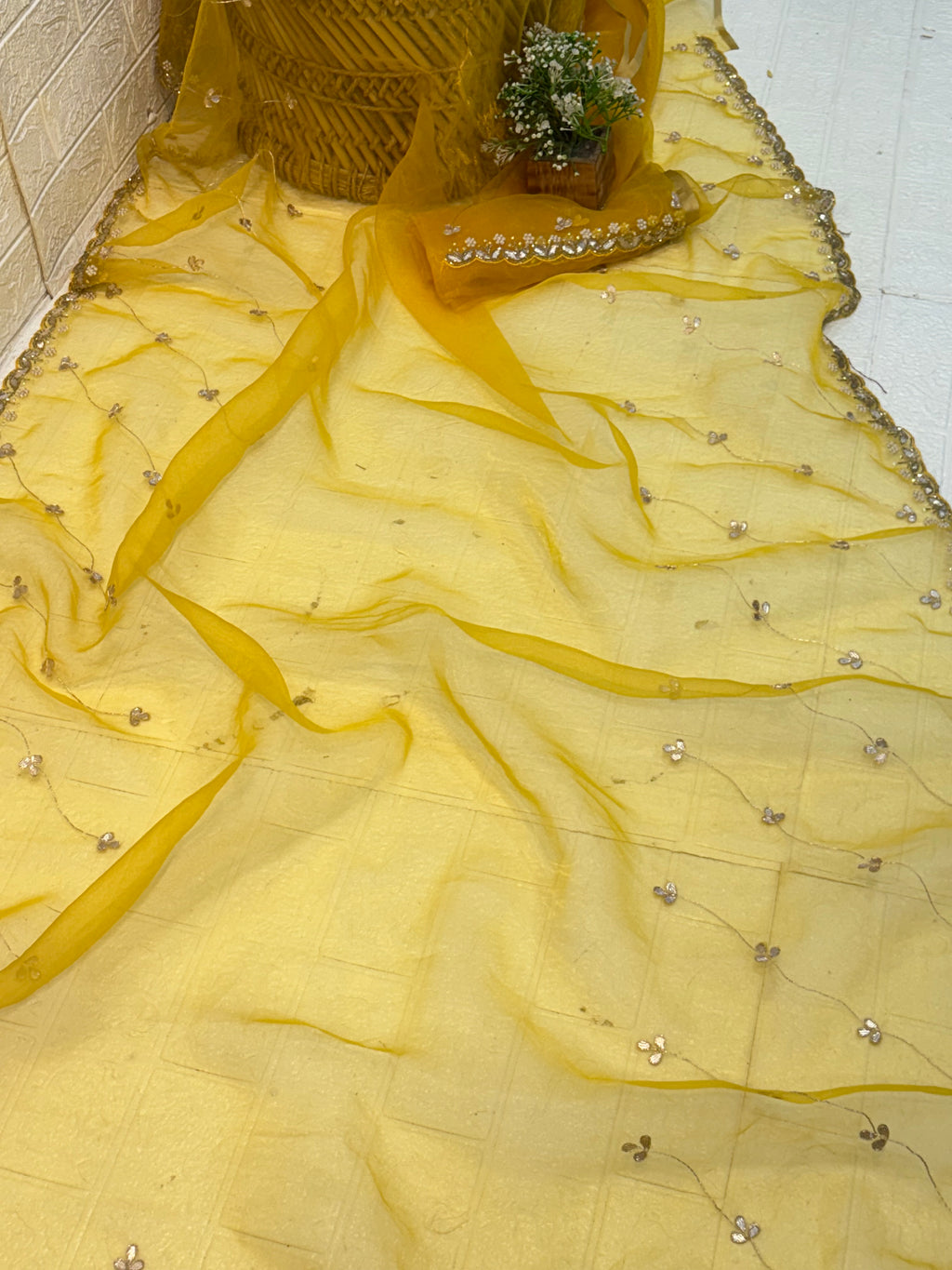 Fabric Soft pure organza adorned with mustard yellow colour delicate floral sequin embroidery and scalloped zari border and Maching blouse with embroidery