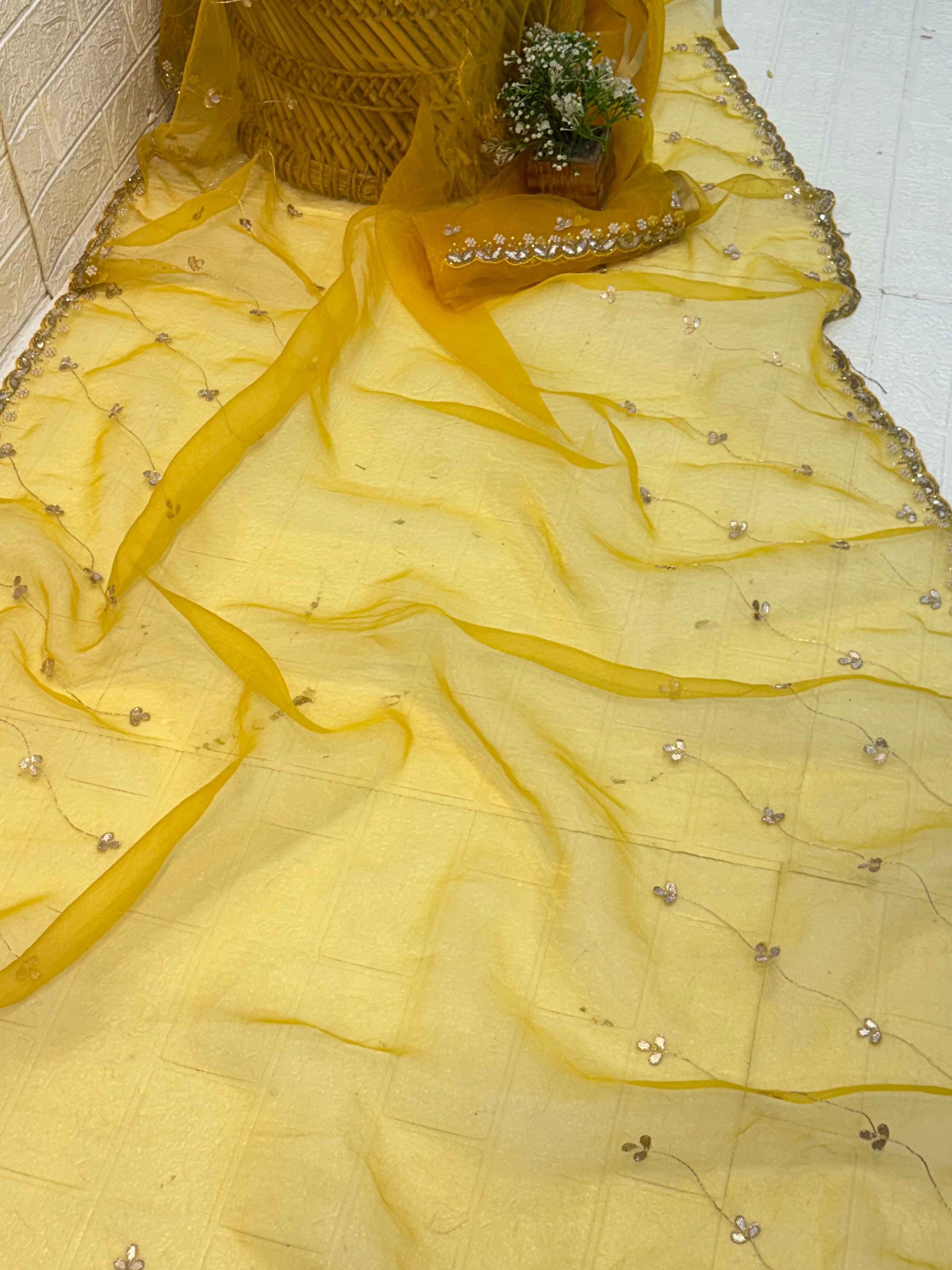 Fabric Soft pure organza adorned with mustard yellow colour delicate floral sequin embroidery and scalloped zari border and Maching blouse with embroidery