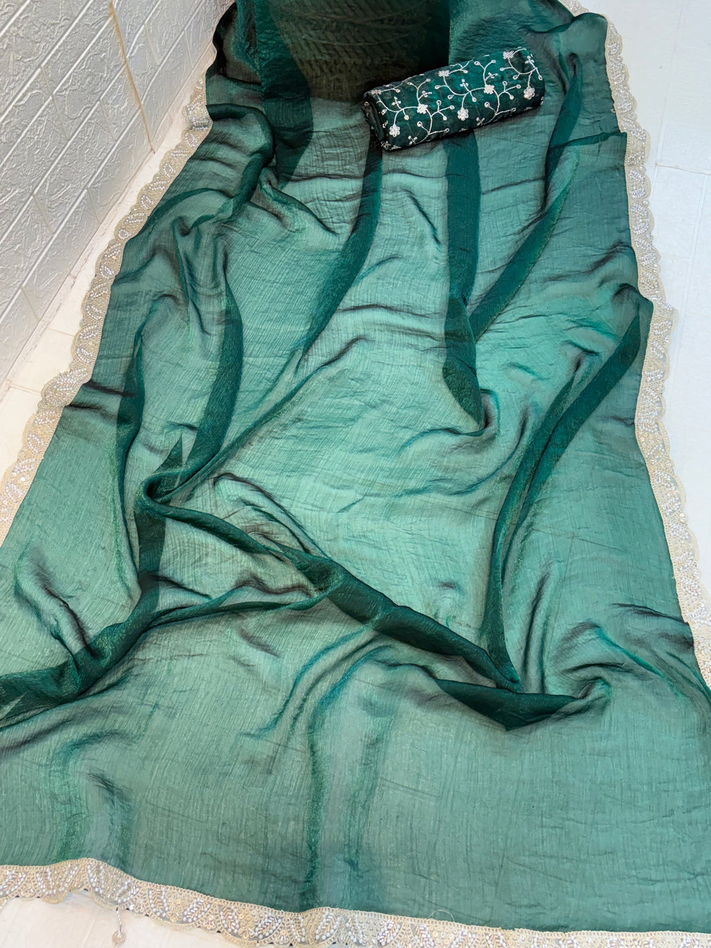 Name: Emerald bottle green colour Saree crush organza fabric with Embroidered Blouse with a soft shimmer finish and thread embroidery blouse piece